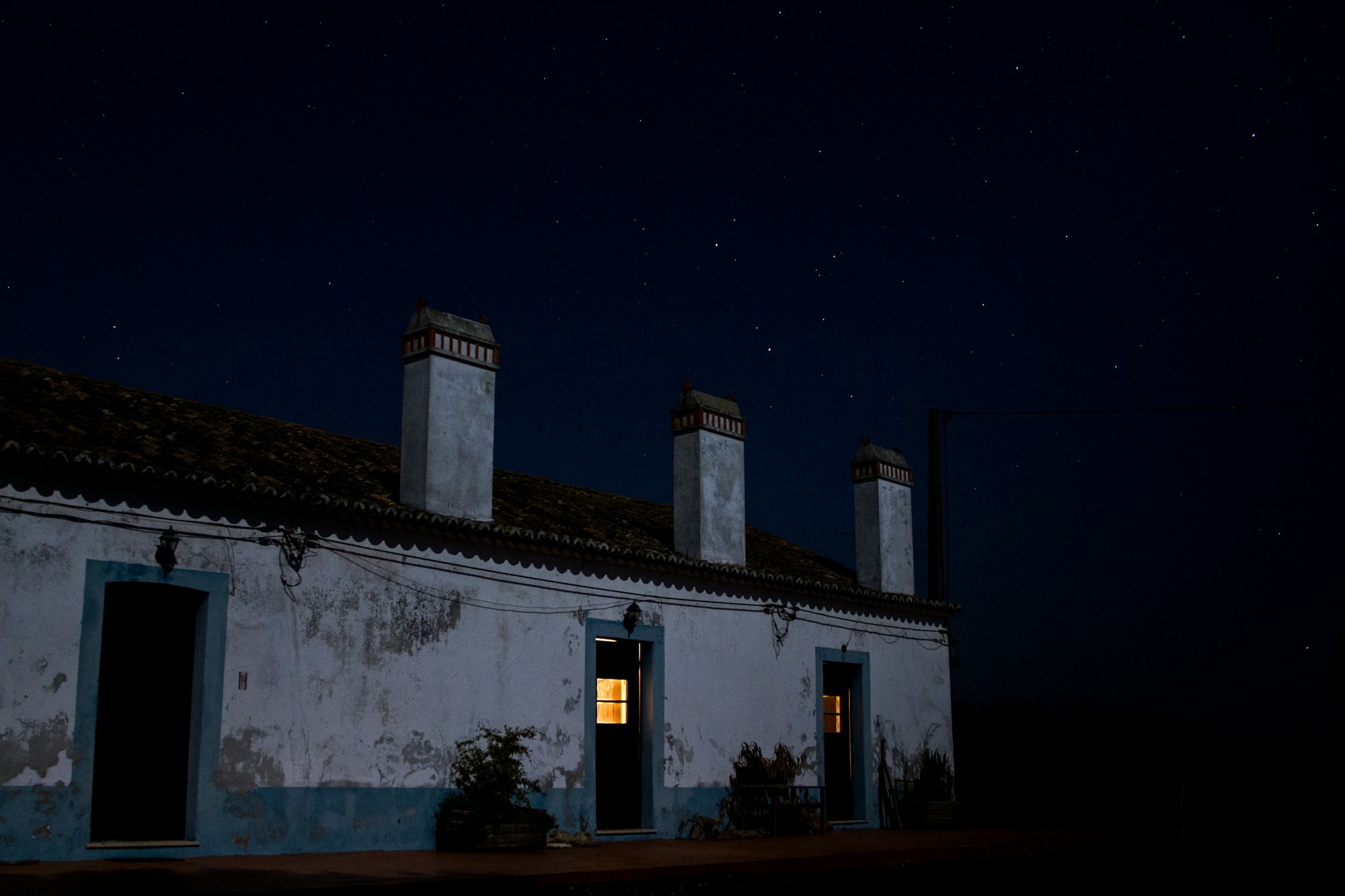 Starry sky reflected in the calm waters of Lake Alqueva in the Alentejo region, Portugal