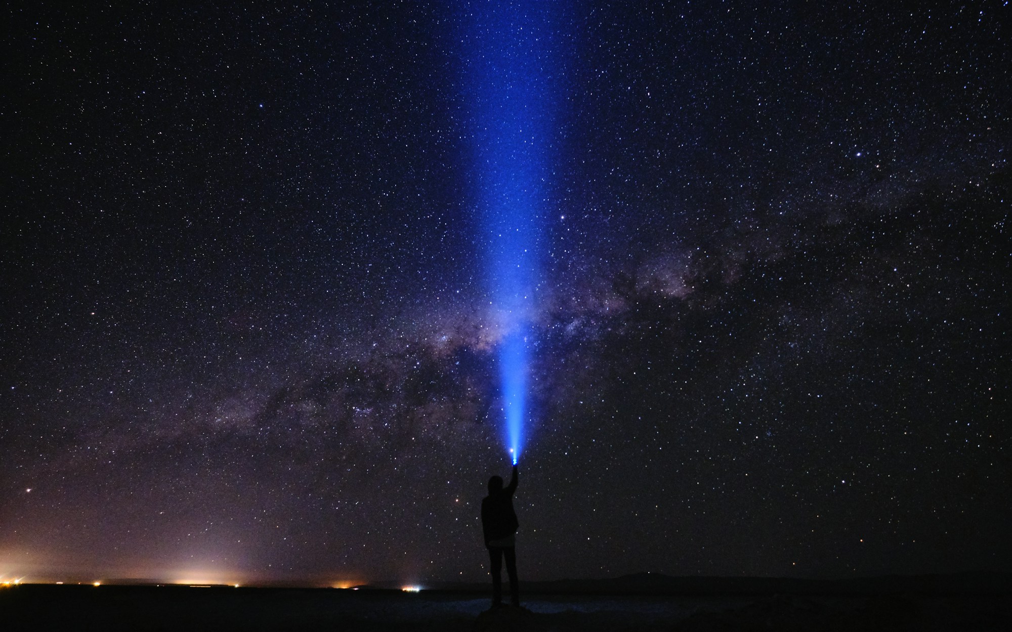 Milky Way above the Atacama Desert in Chile, with rock formations in the foreground