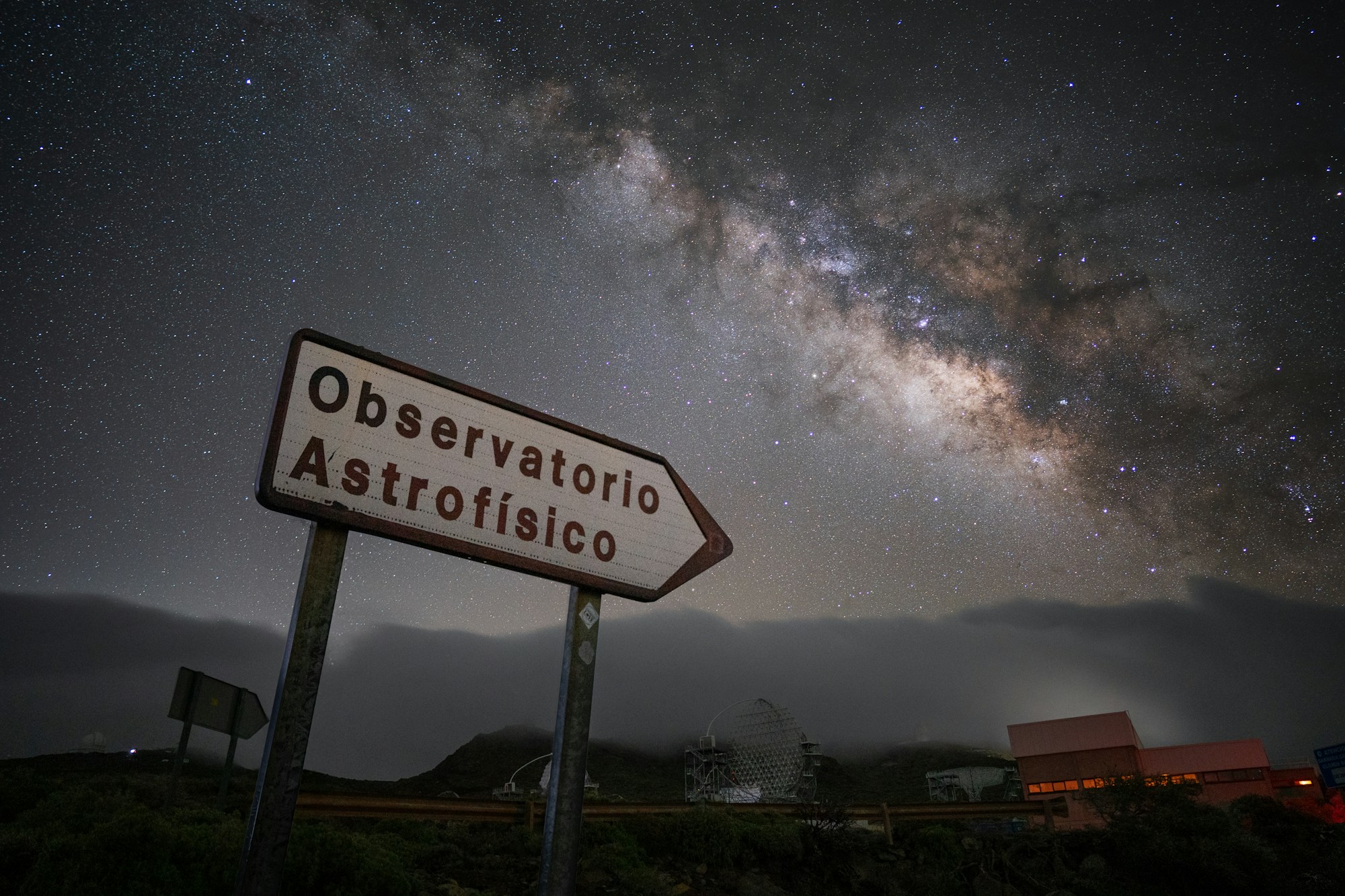 Roque de los Muchachos observatory telescopes under a starry sky on La Palma, Canary Islands