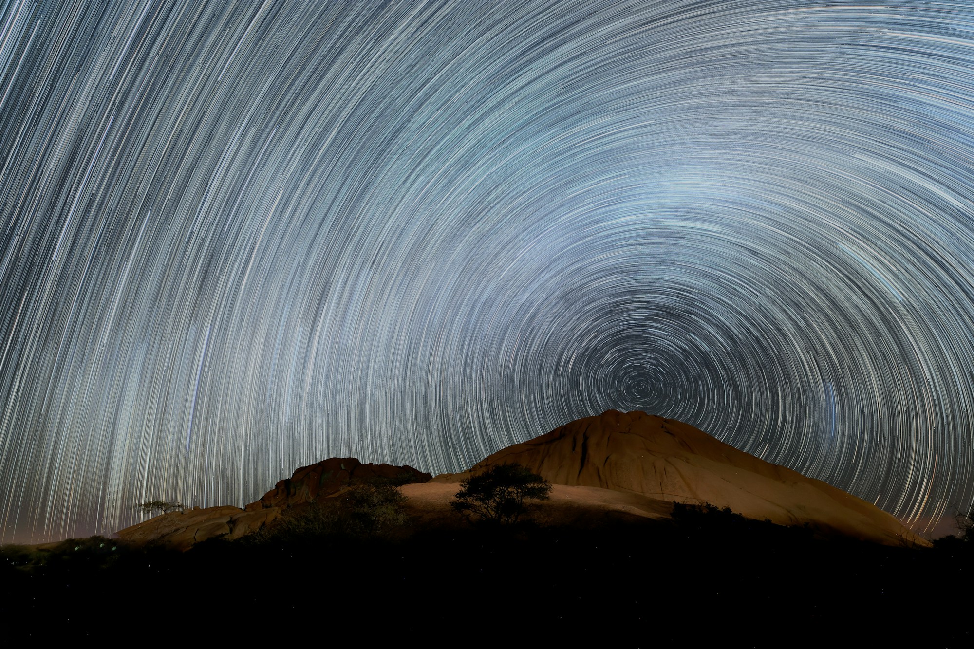 Starry sky above the red dunes of NamibRand Nature Reserve in Namibia