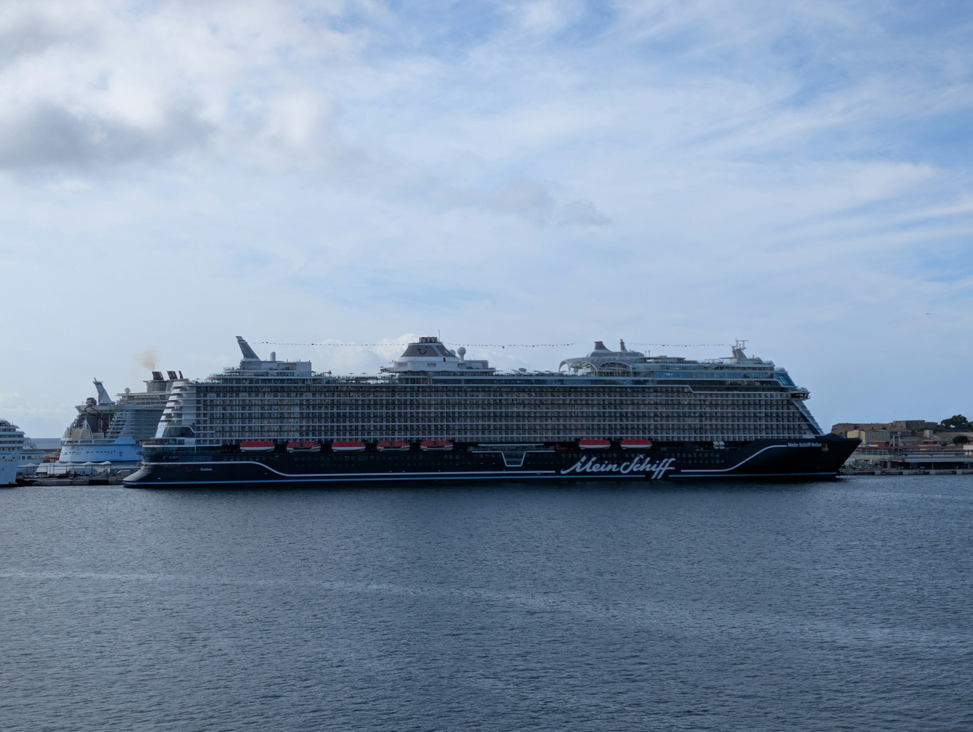 Large cruise ship docked in a Mediterranean port