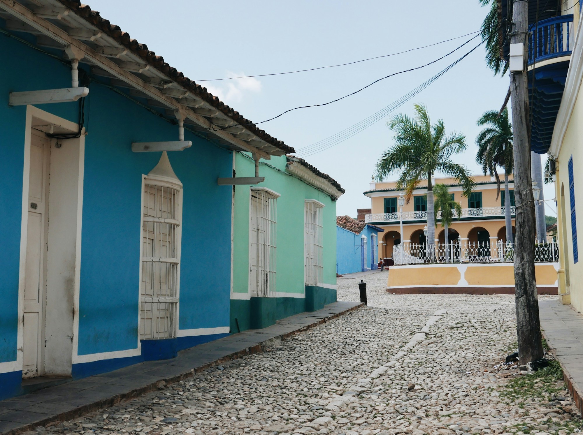 Cobblestone street with colourful colonial houses in Trinidad, Cuba
