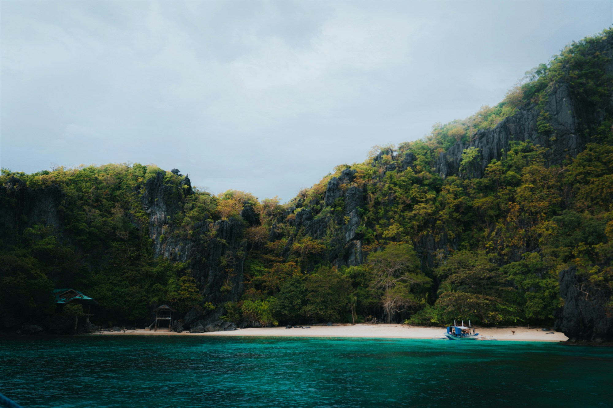 Tropical beach with mountains and turquoise waters in Palawan, Philippines