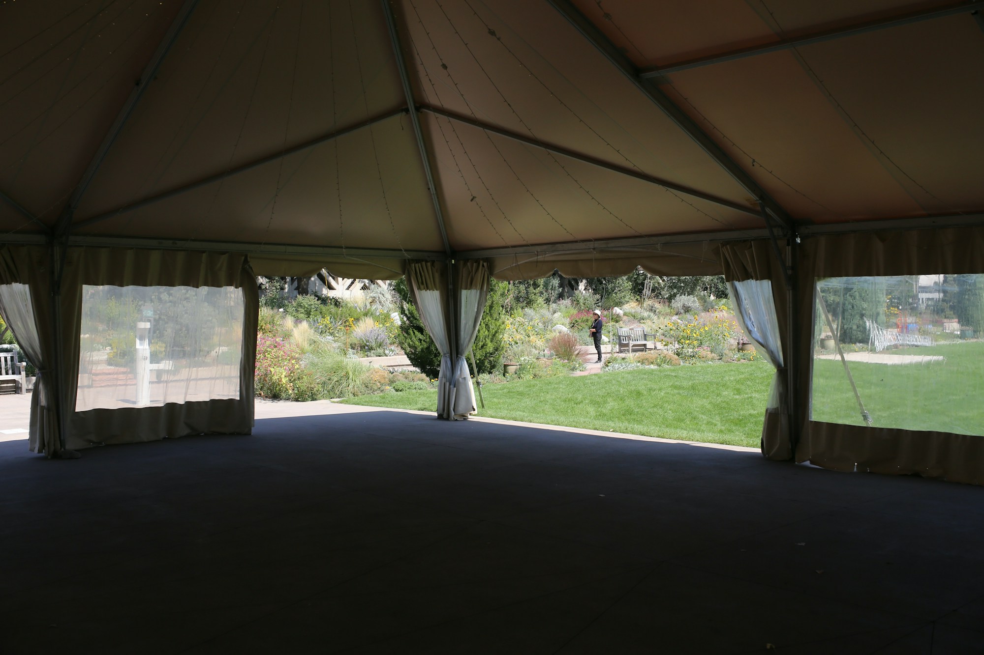 Large yurt tent with curtains in a natural Mediterranean setting