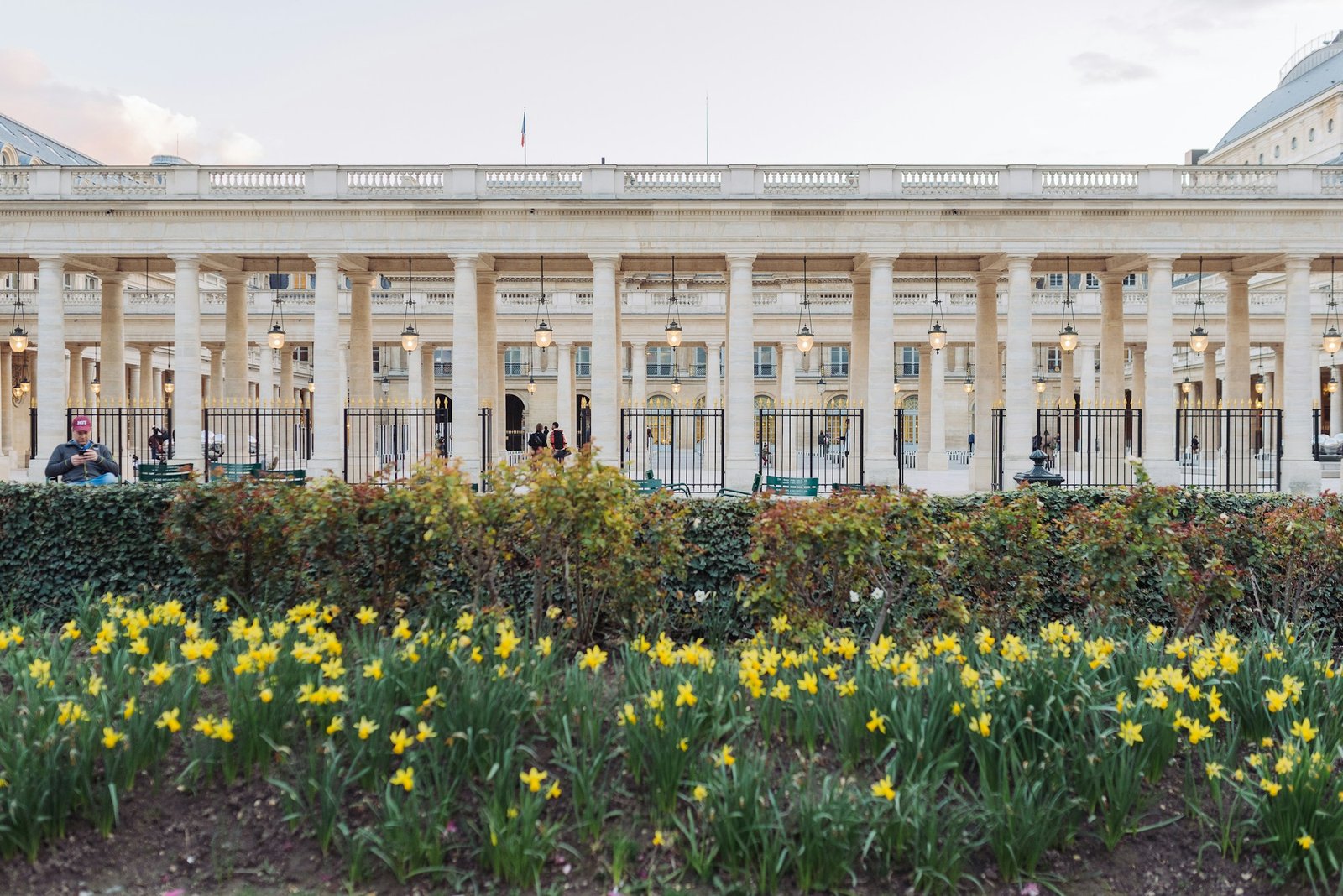 Gardens and arcades of the Palais-Royal in Paris at dusk