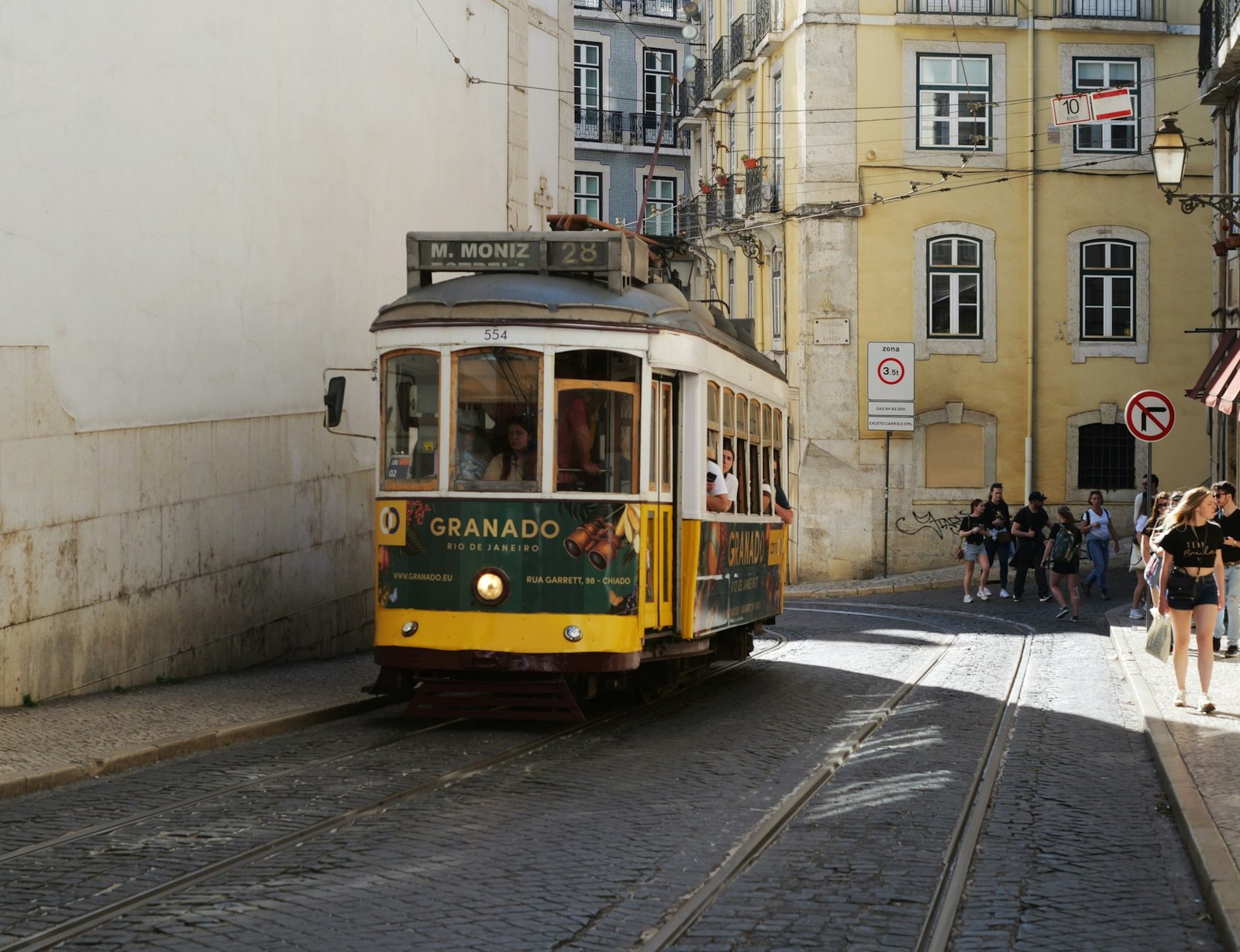 Vintage tram 28 in Lisbon streets, Alfama