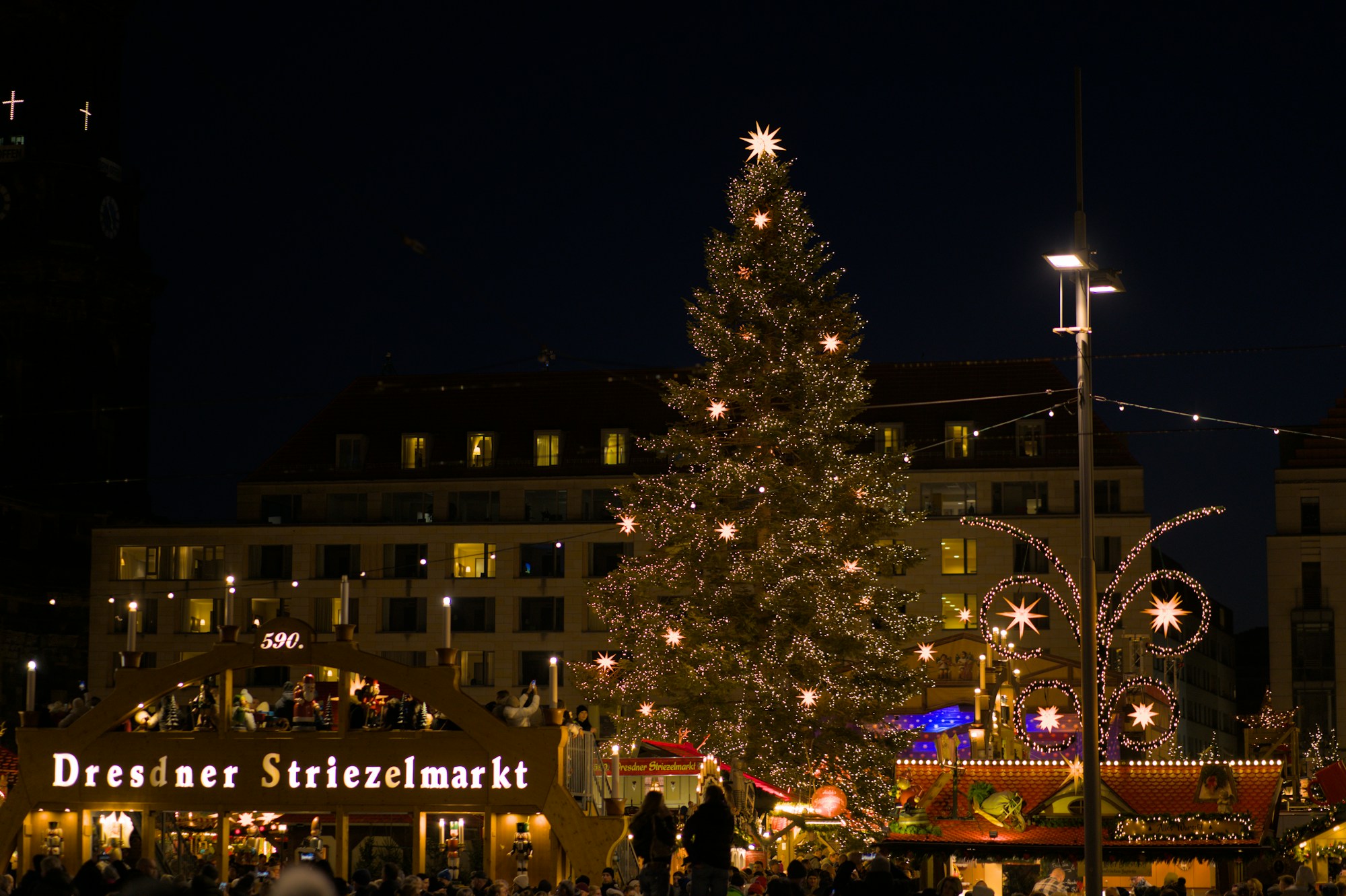 Dresden Striezelmarkt with the large Christmas pyramid and illuminated chalets