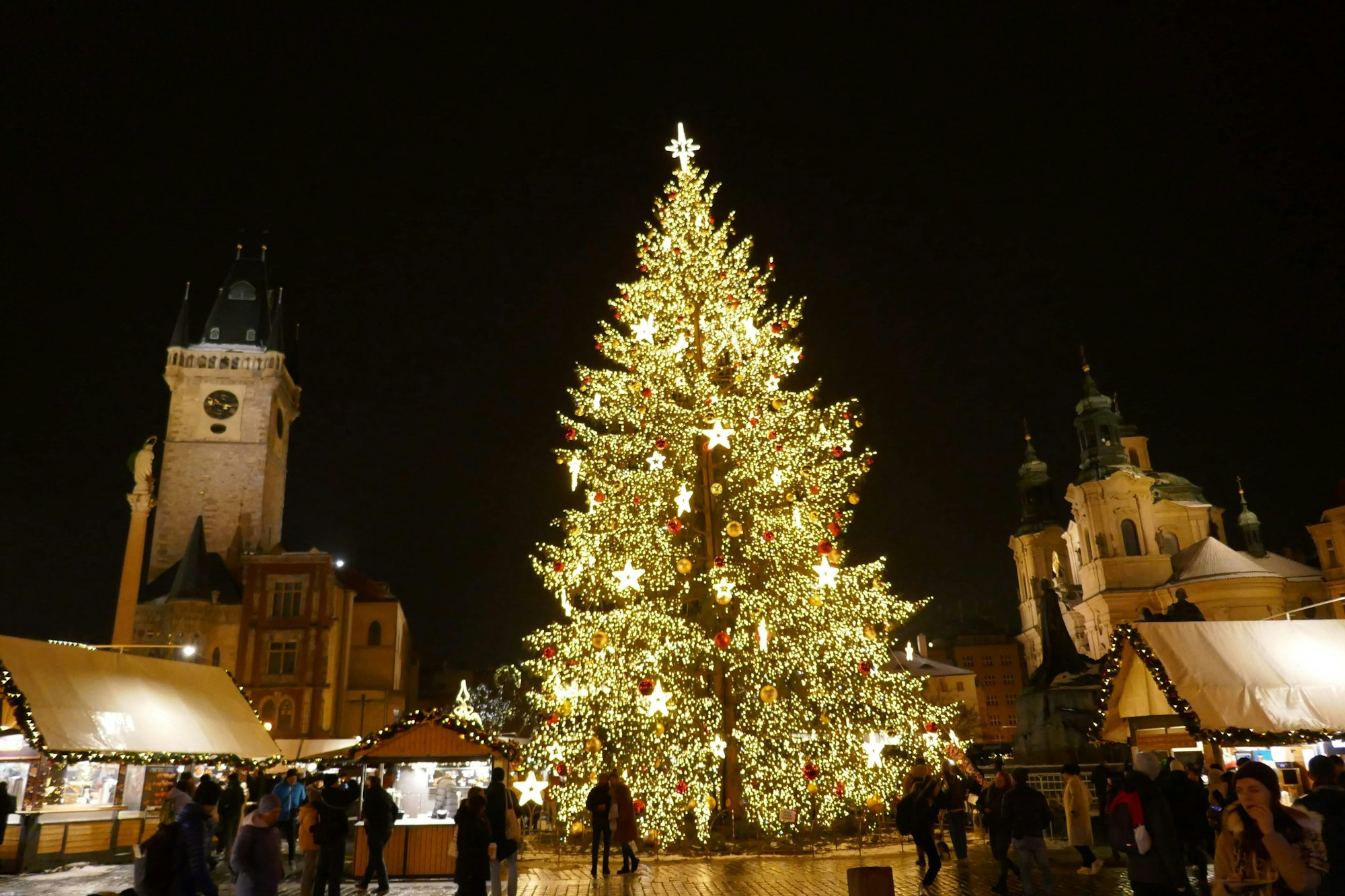 Prague Christmas Market on Old Town Square with the illuminated Astronomical Clock