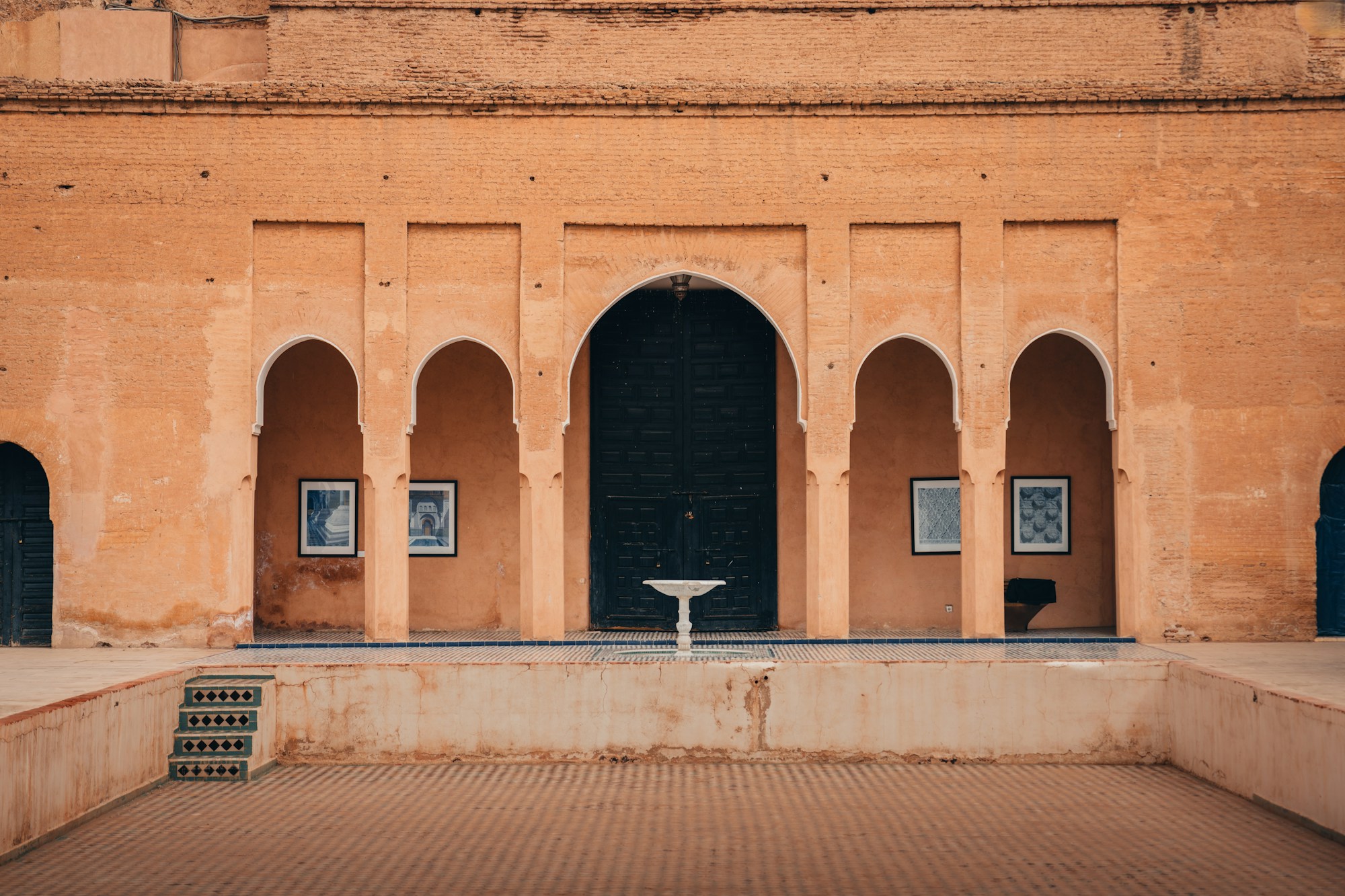 Inner courtyard of a riad in Marrakech with arches and traditional Moorish architecture