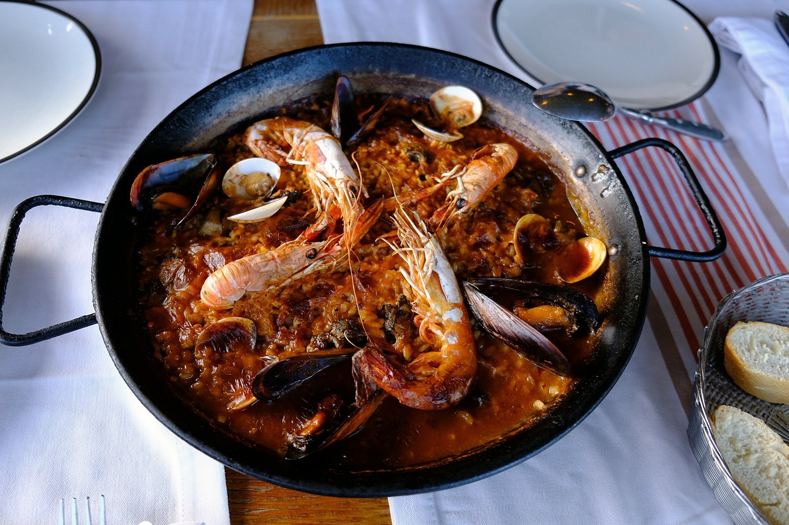 Traditional Spanish paella with seafood in metal pan