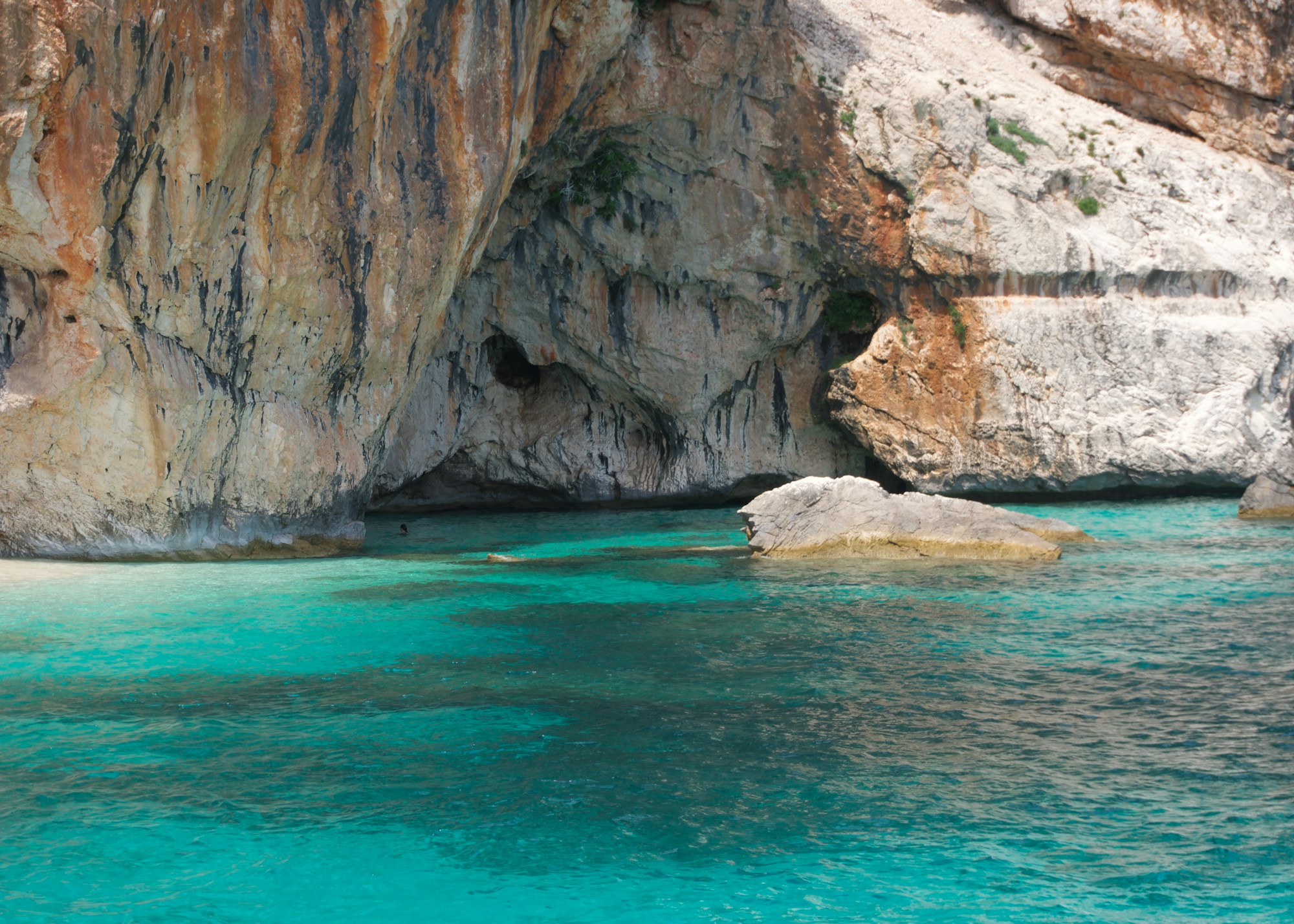 Rocky cove with translucent waters of Cala Sa Figu on the south-east coast of Sardinia