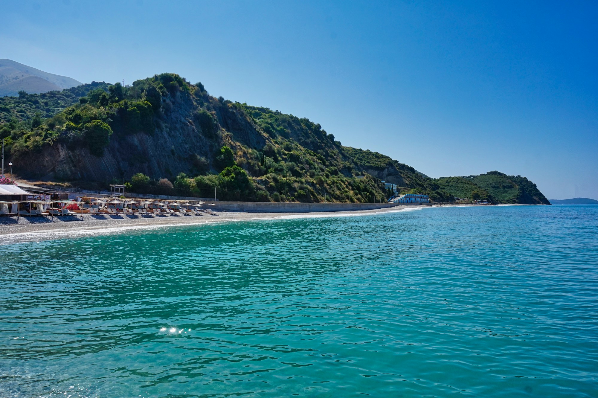 Crystal-clear waters of Mirror Beach on the Albanian Riviera near Ksamil, nicknamed the Maldives of Europe