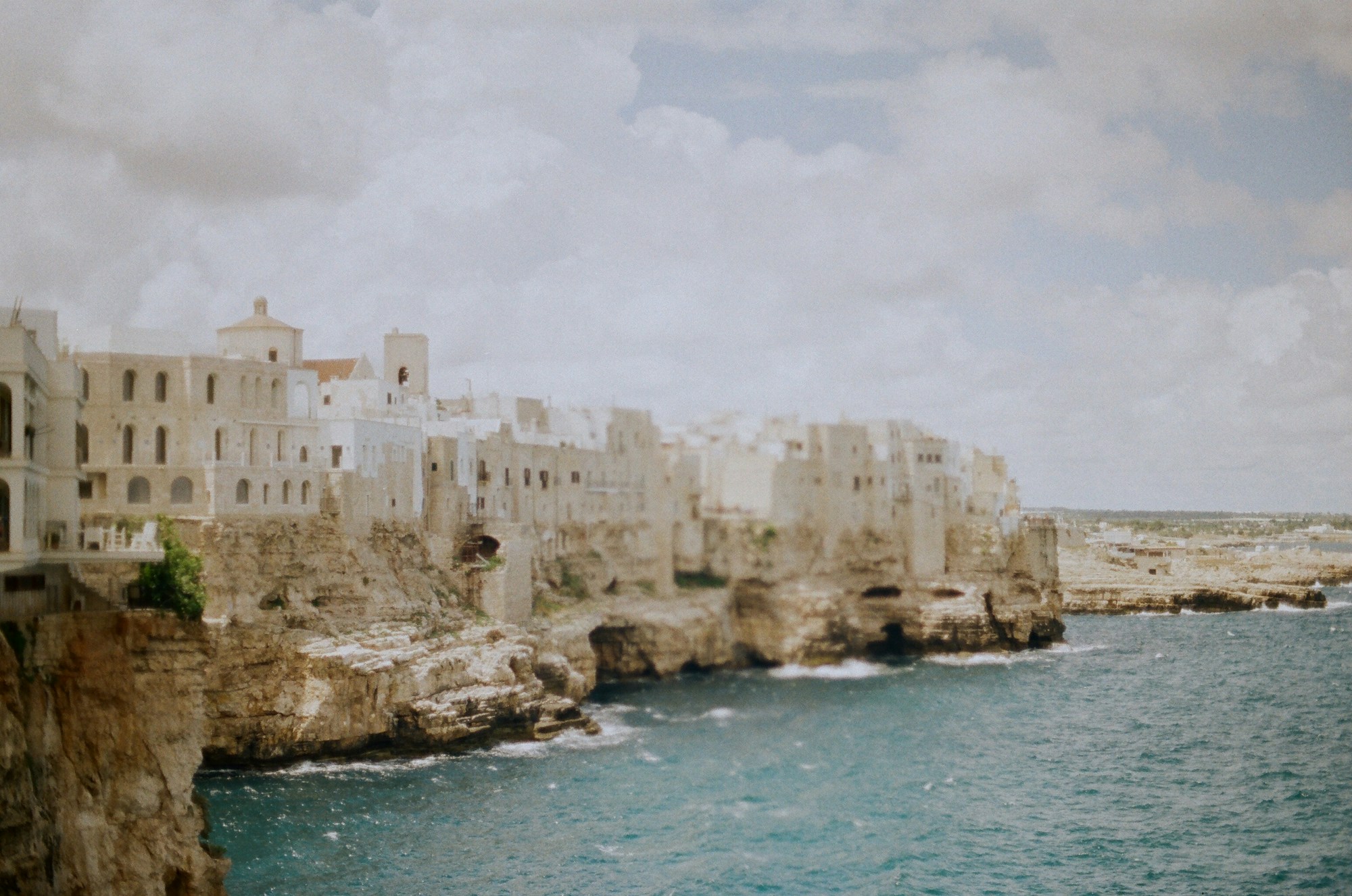 Cliffs and houses overlooking the sea in Polignano a Mare, Puglia, Italy