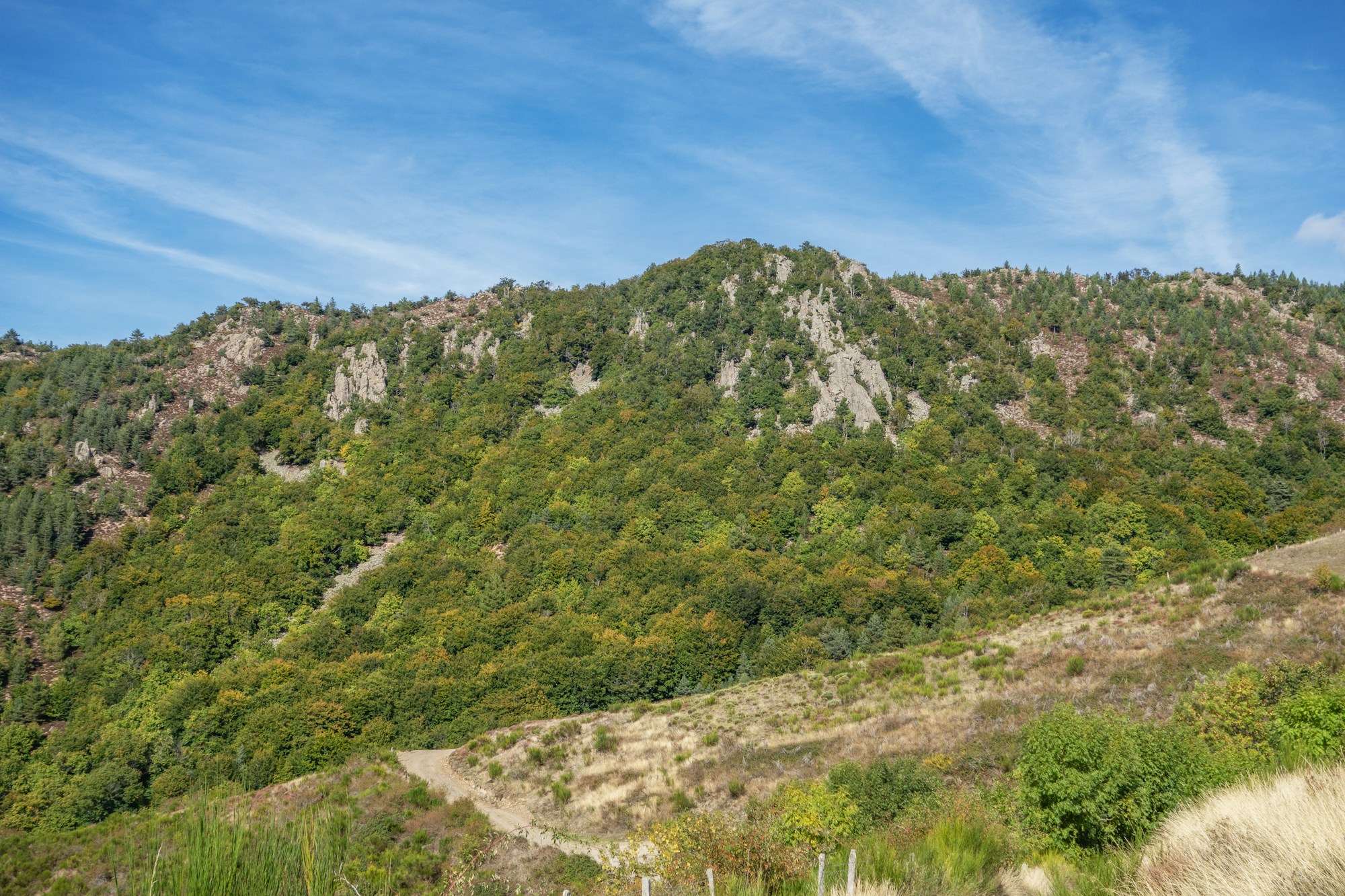 Cévennes landscape with mountains, green valleys, and blue sky