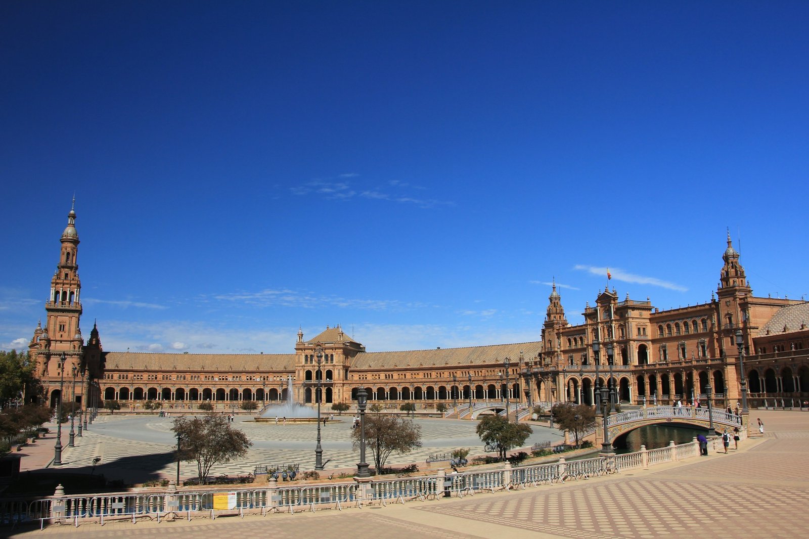 Plaza de España in Seville, reflections in water at sunset