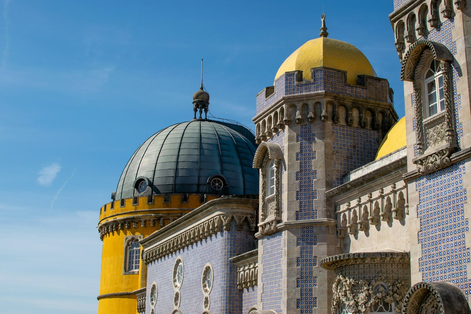 Pena Palace in Sintra, colorful facade under blue sky