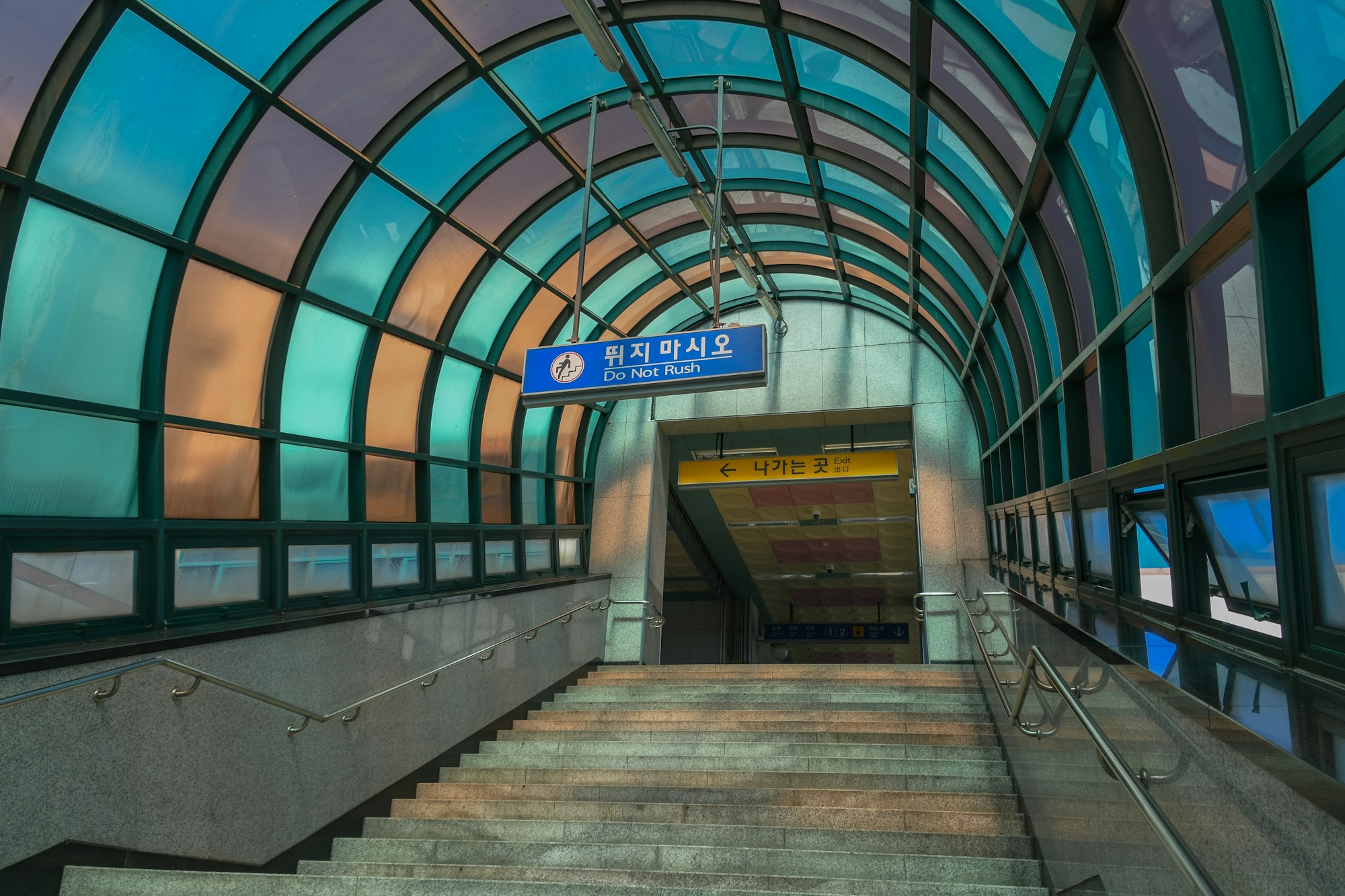 Seoul metro corridors with hurrying commuters in Korean underground stations