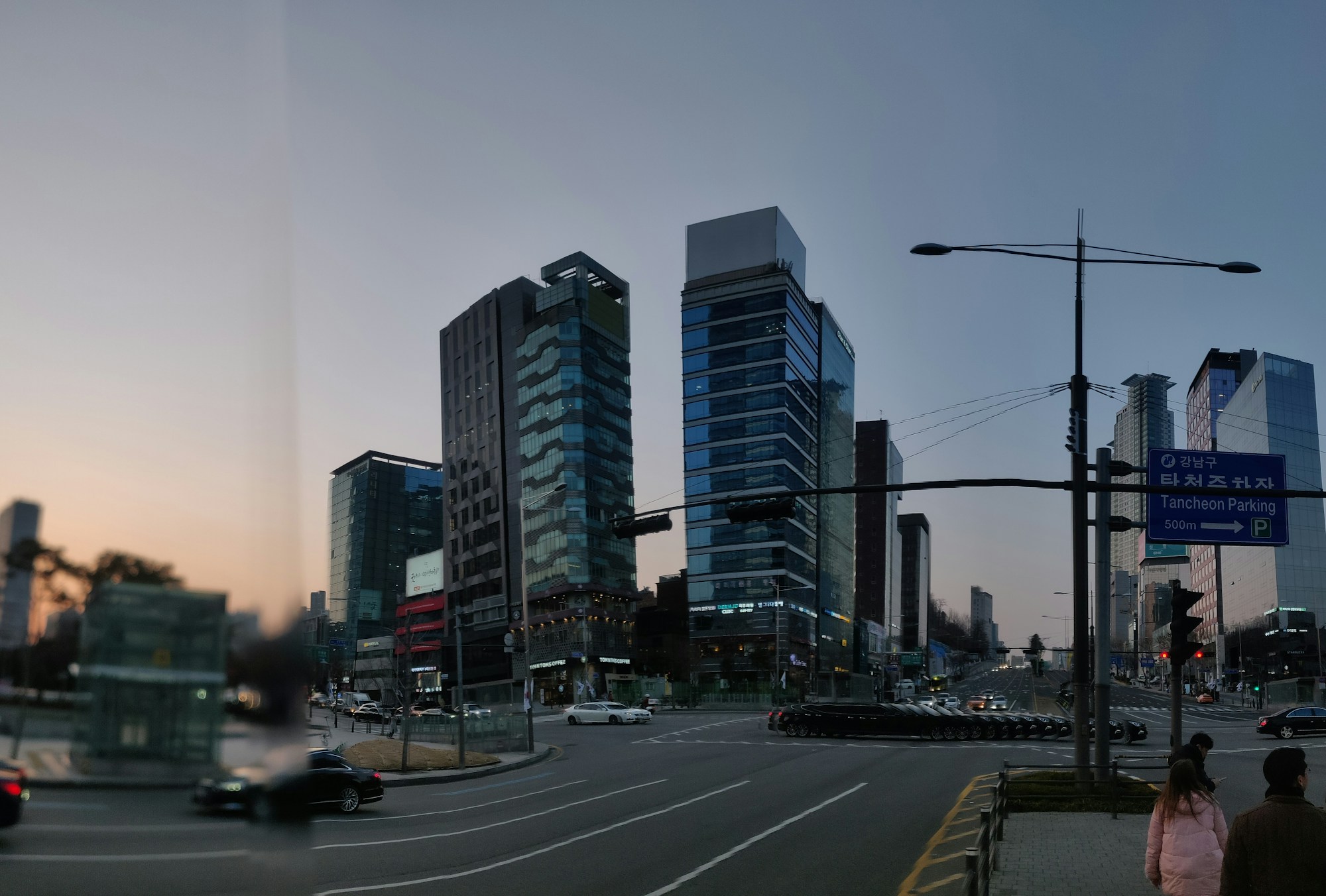 Busy Seoul streets with apartment buildings and traffic, typical of Korean residential neighbourhoods