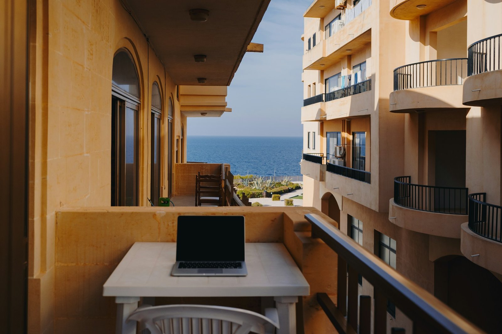 Remote work from terrace with Mediterranean view, laptop