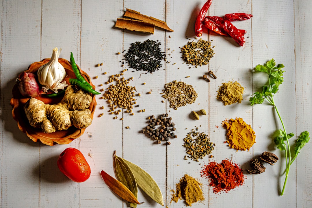 Assortment of colorful Indian spices in bowls at a Kerala market