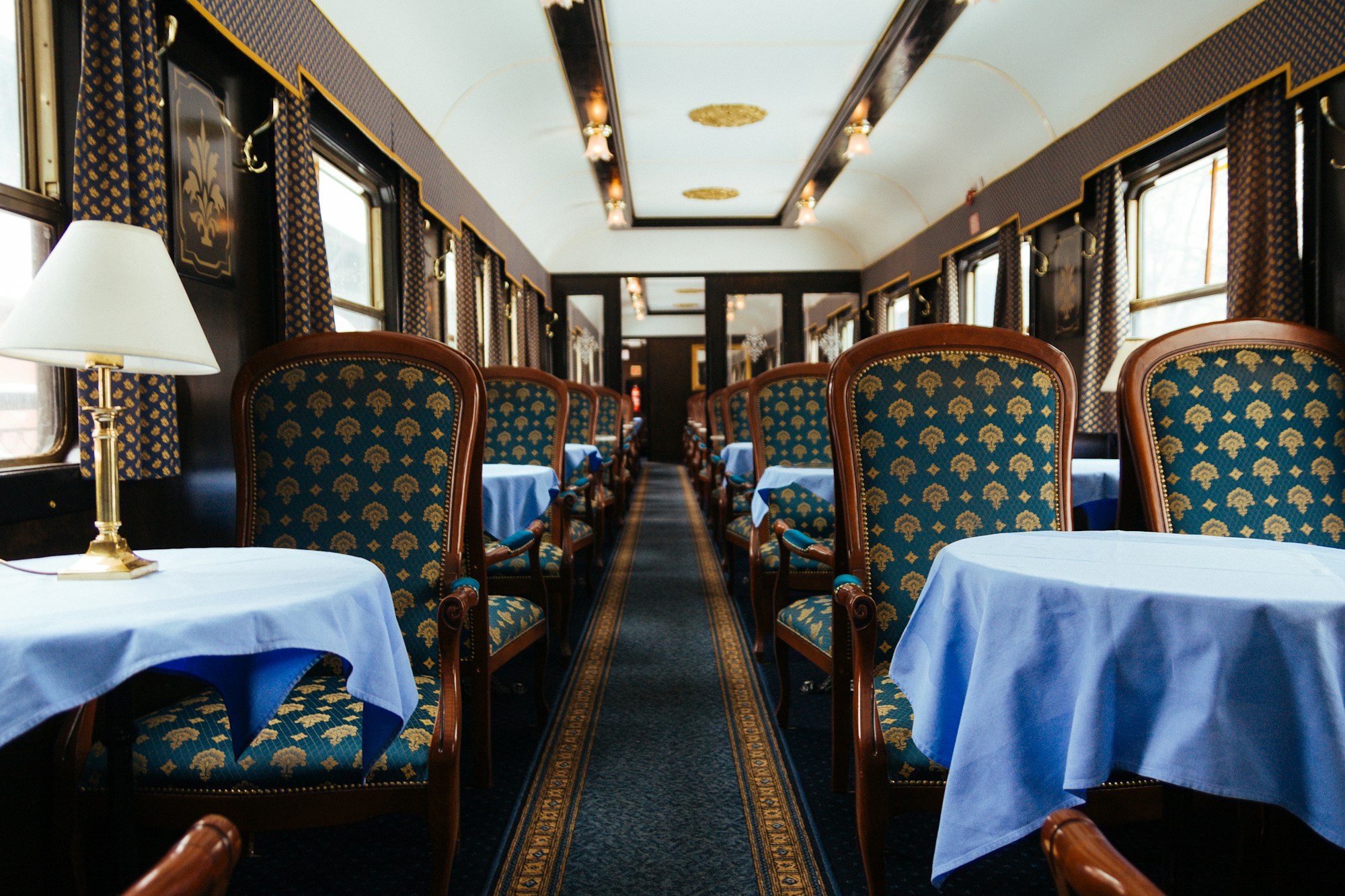 Luxurious interior of a train carriage with refined decoration reminiscent of the Orient Express