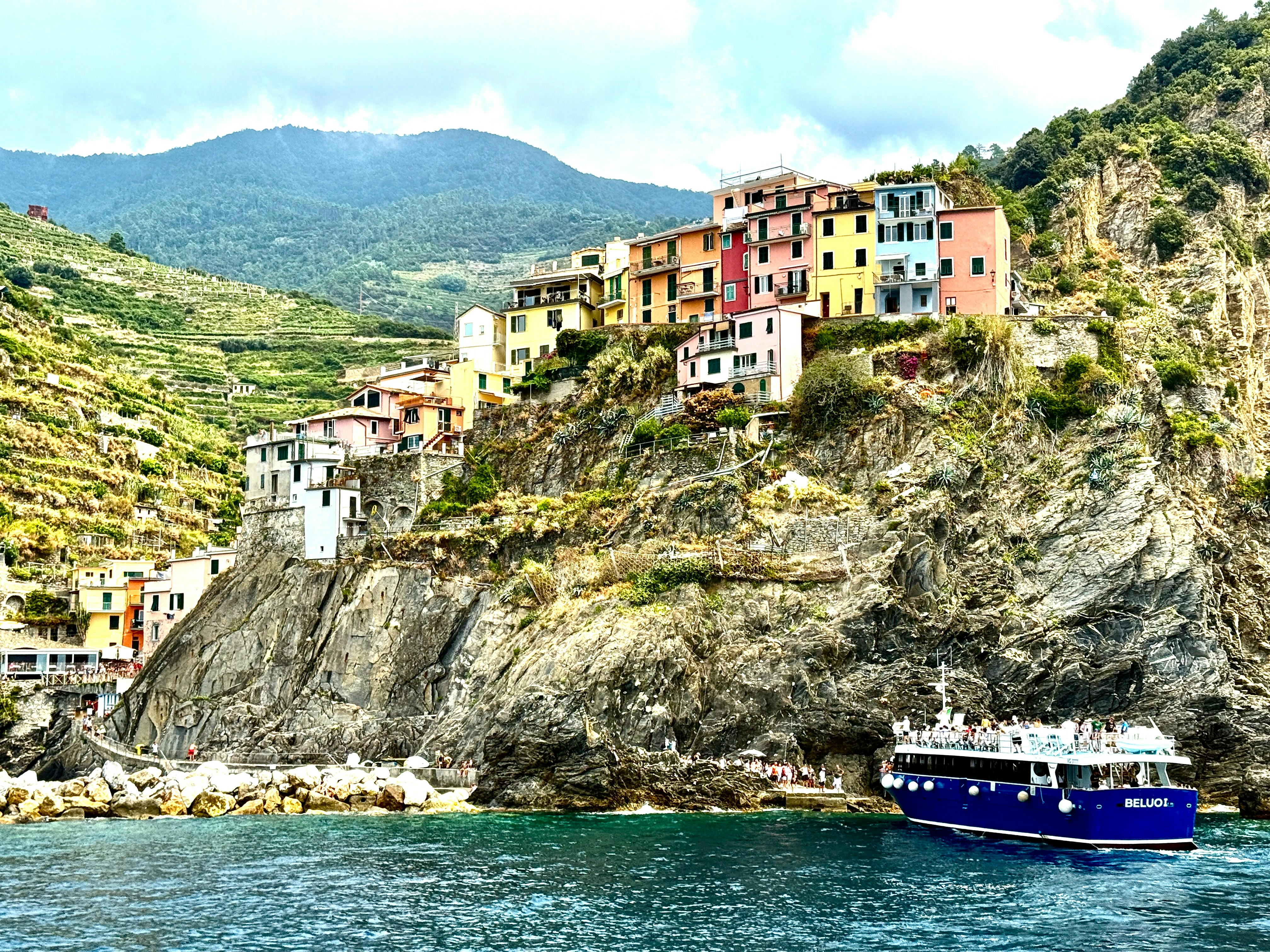 Colourful village perched on a cliff overlooking the Mediterranean Sea on the Italian Riviera