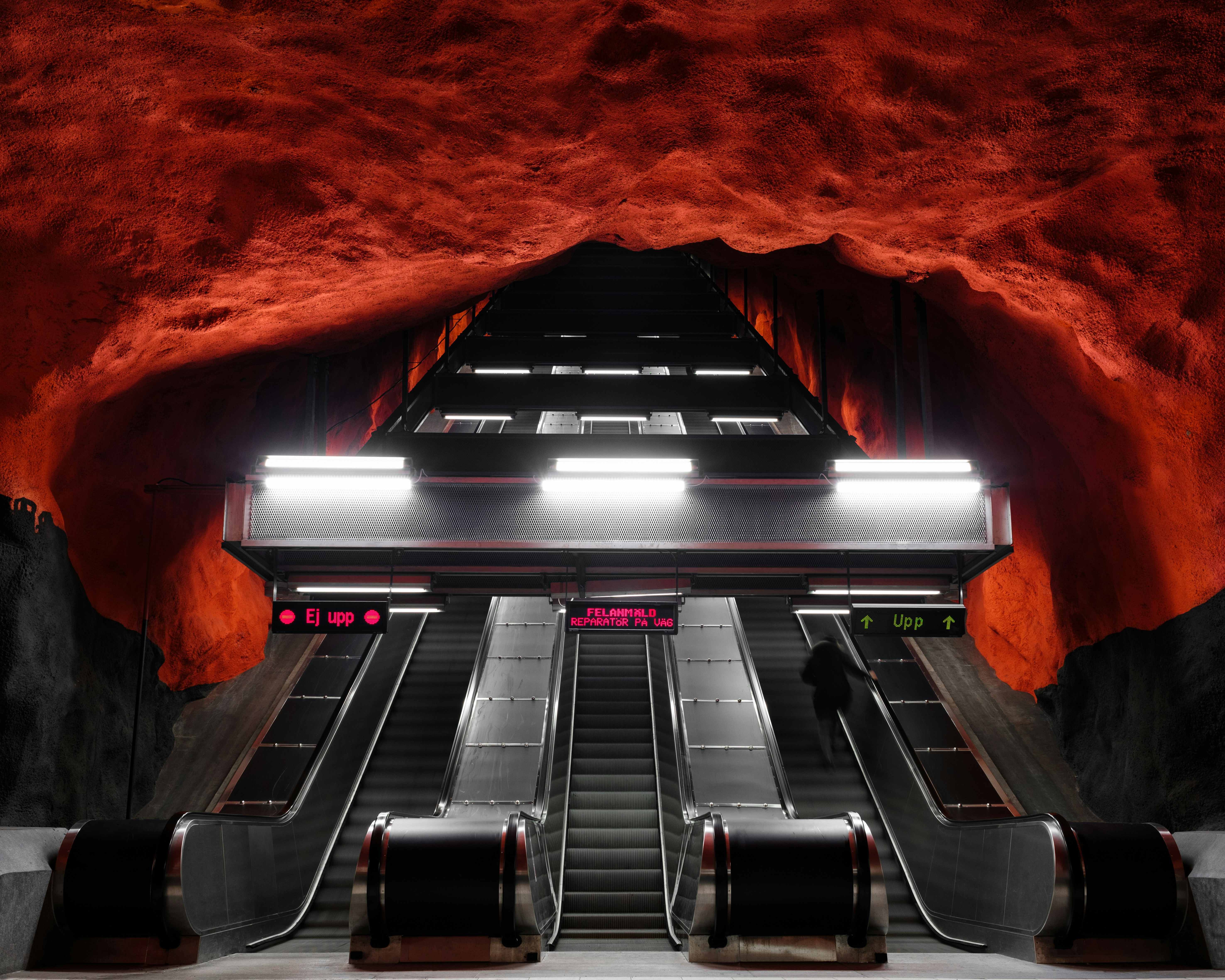 Solna Centrum metro station in Stockholm with its spectacular red ceiling