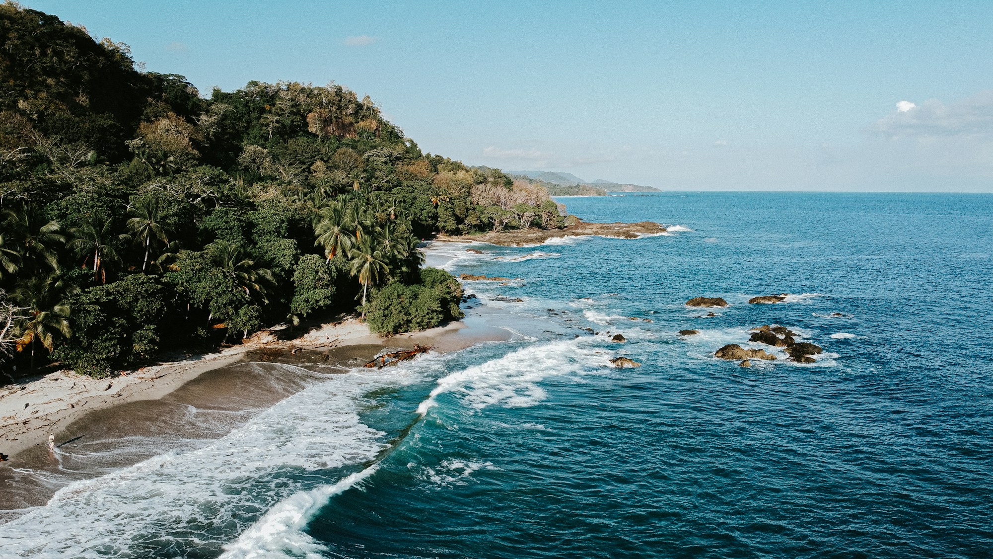 Aerial view of a tropical beach in Costa Rica, a nature destination for remote workers