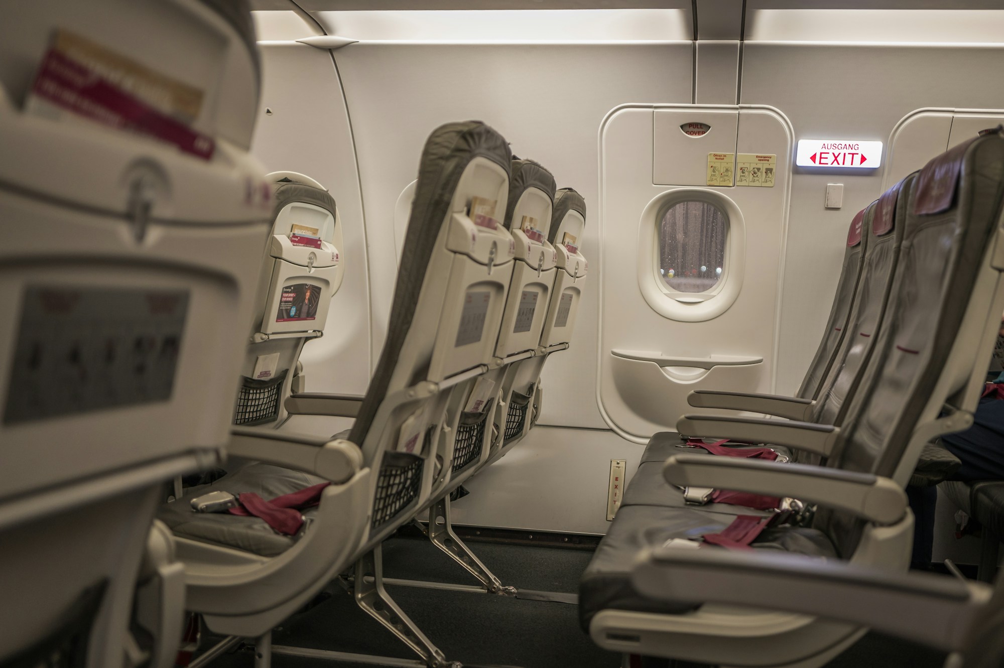 Interior of a modern airplane cabin with ambient lighting