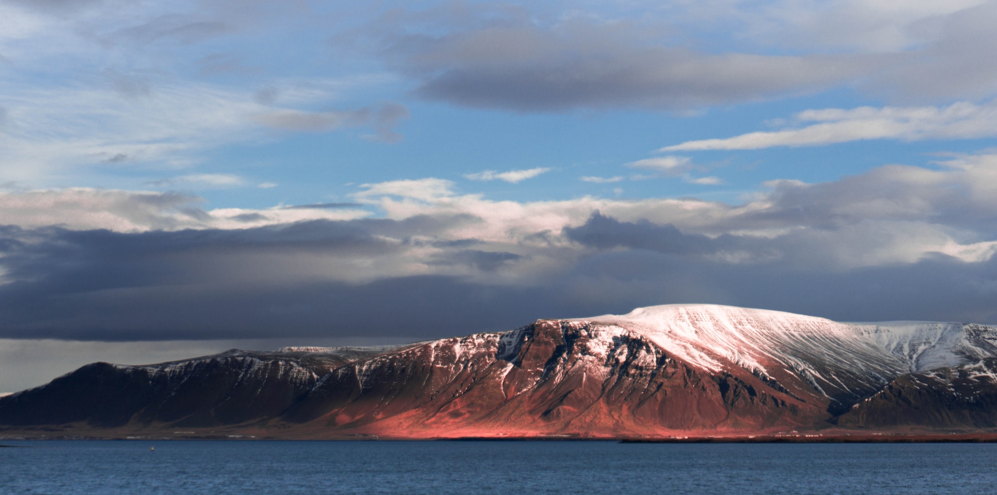 Spectacular Icelandic landscape with mountains and colourful sky