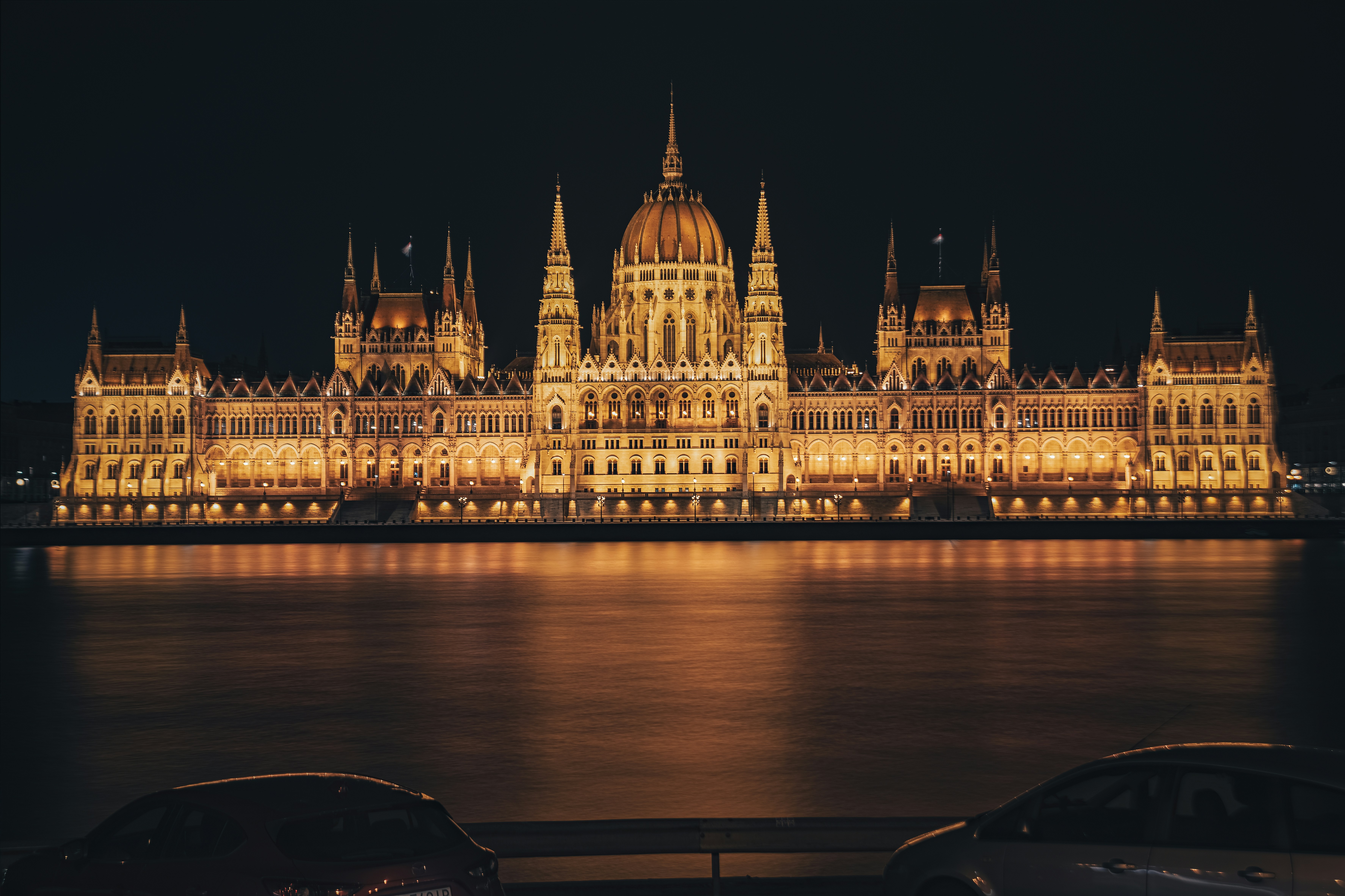 Budapest Parliament illuminated at night along the Danube, Hungary
