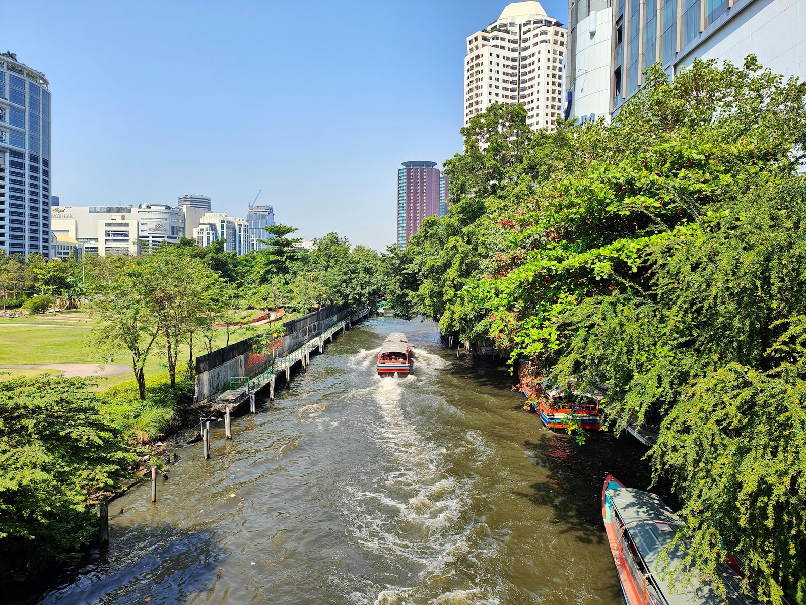 Boat crossing a historic canal in central Bangkok, Thailand