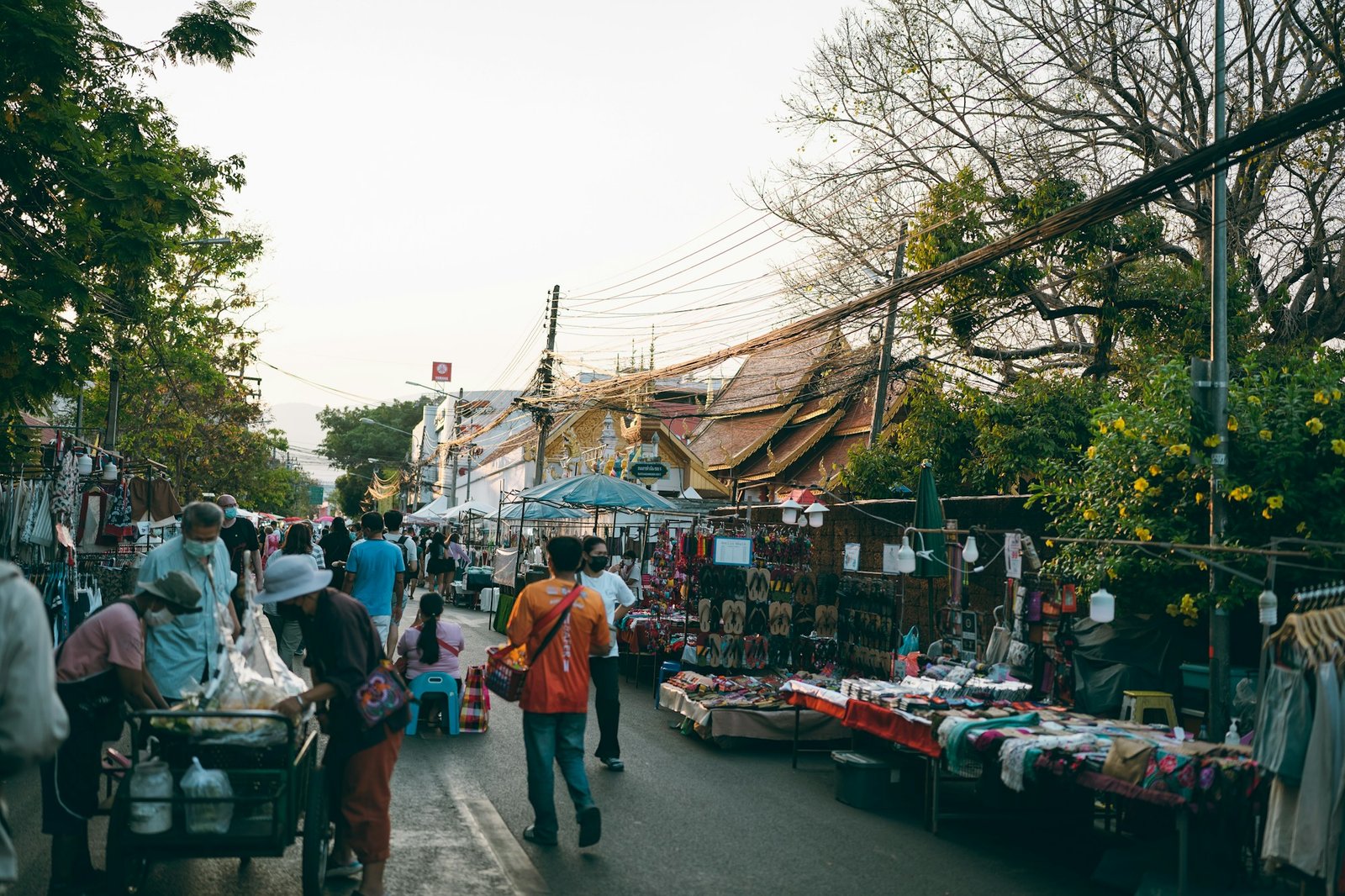 Bustling night market in Chiang Mai, Thailand, with colorful stalls