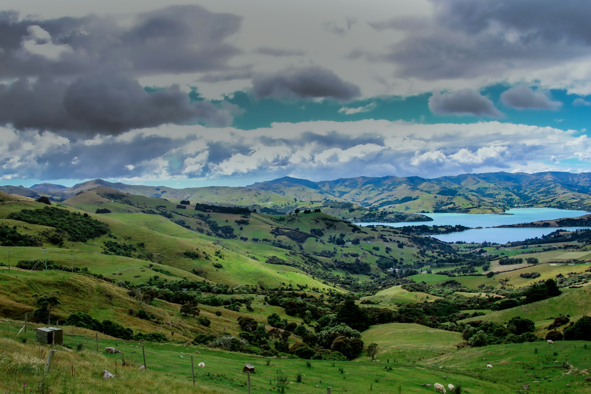 Picturesque village of Akaroa on the edge of its natural harbor, Banks Peninsula