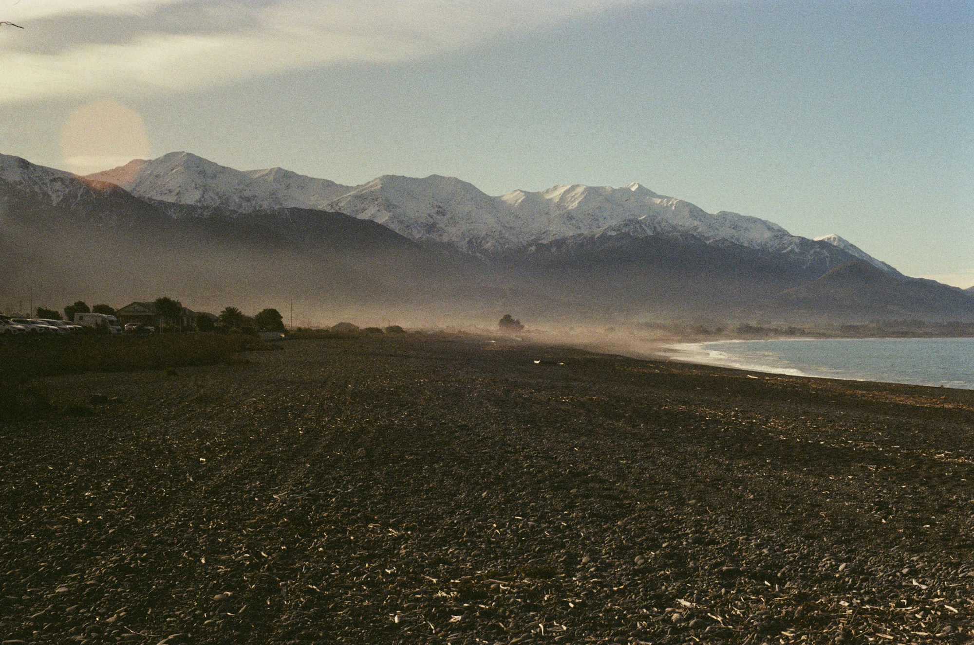 Snow-capped Kaikoura Ranges plunging into the Pacific Ocean