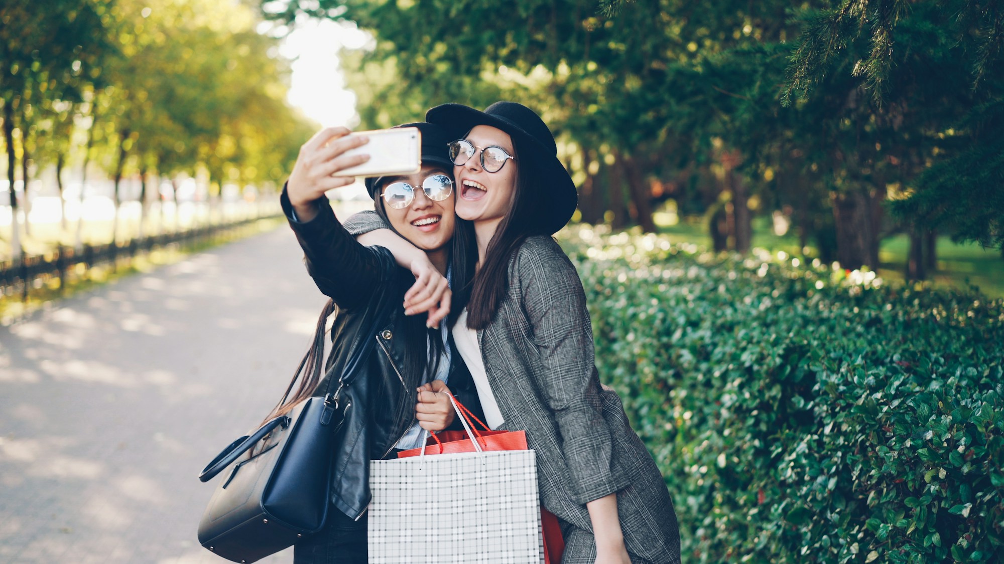 Young women taking a selfie on a group trip
