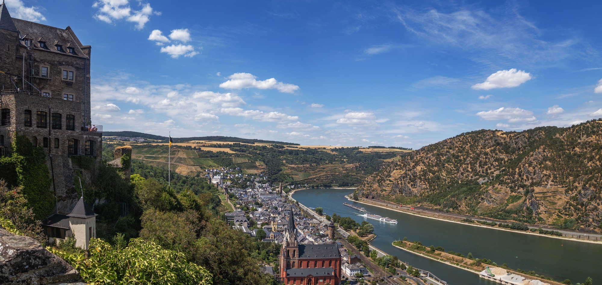 Medieval castle overlooking the Rhine and a Rhenish village in Germany