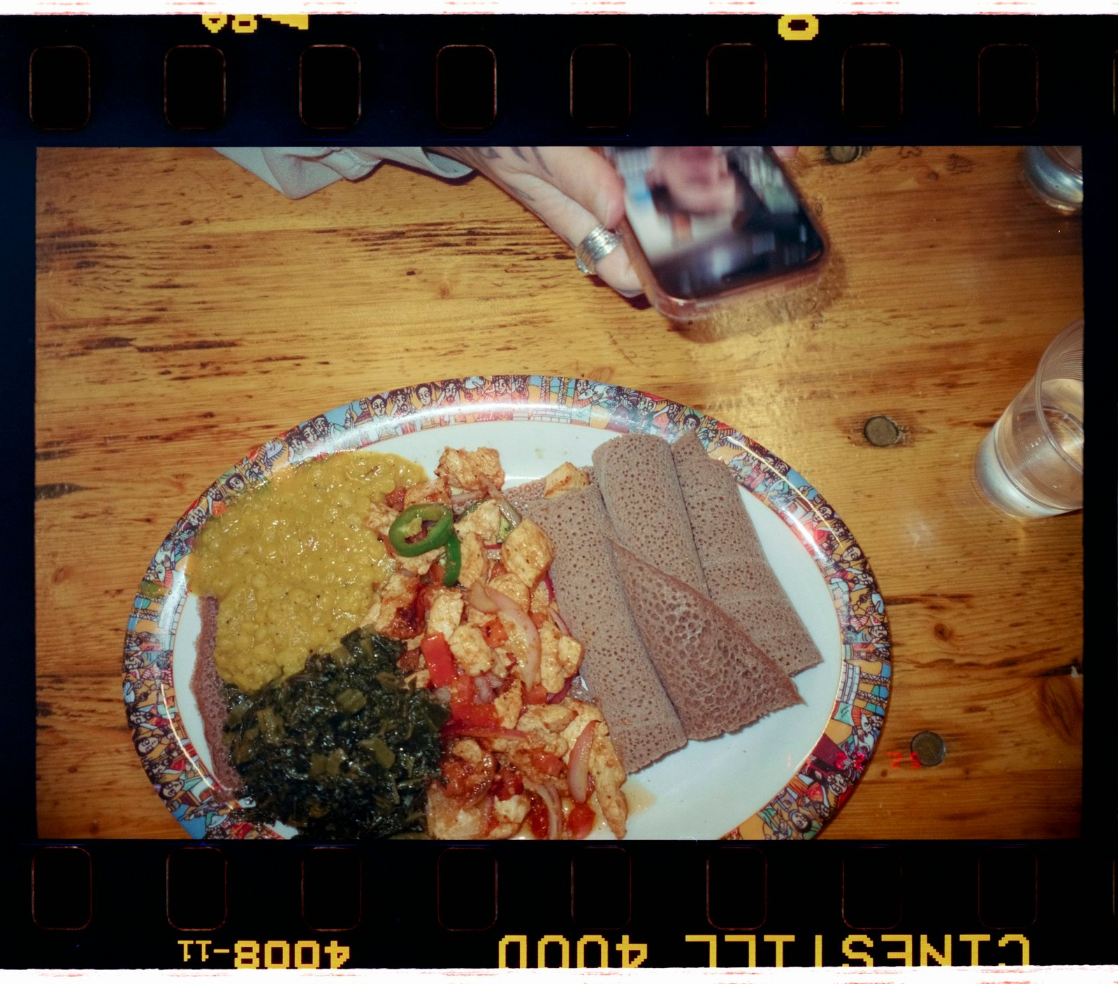 Ethiopian injera platter with lentil stews and colorful vegetables
