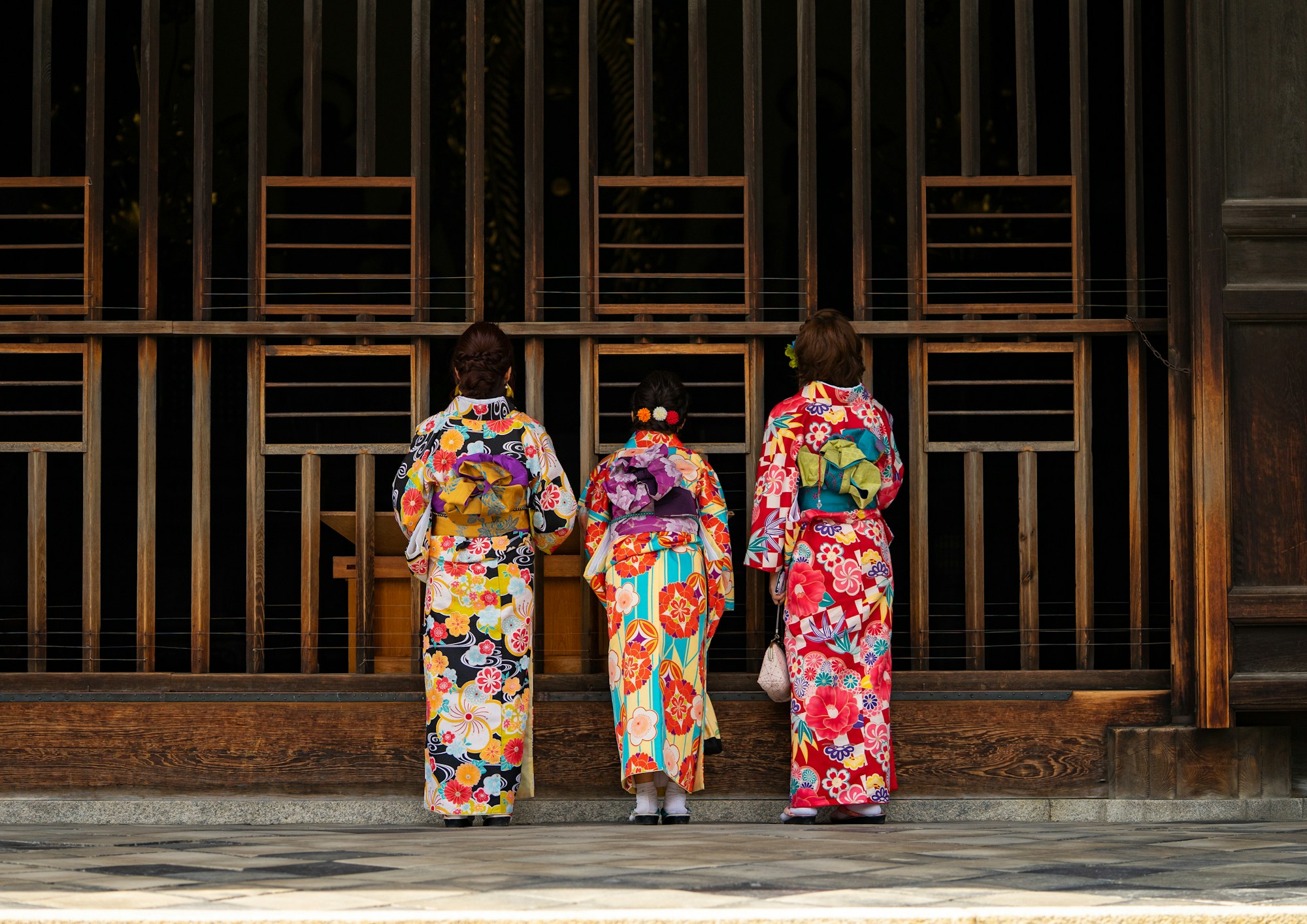 Traditional Kyoto temple in spring with women in kimono