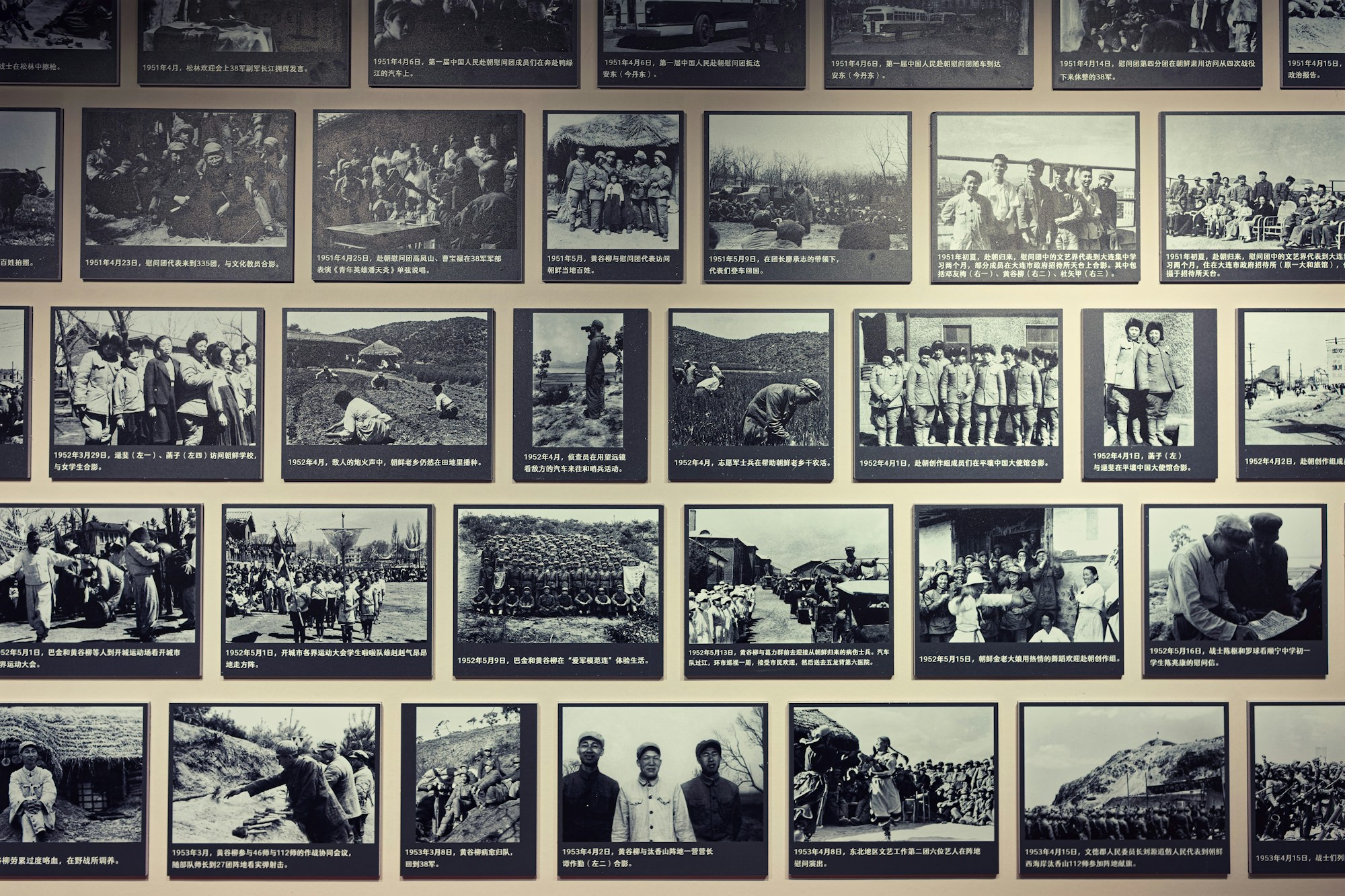 Black and white photographs on display in a museum gallery