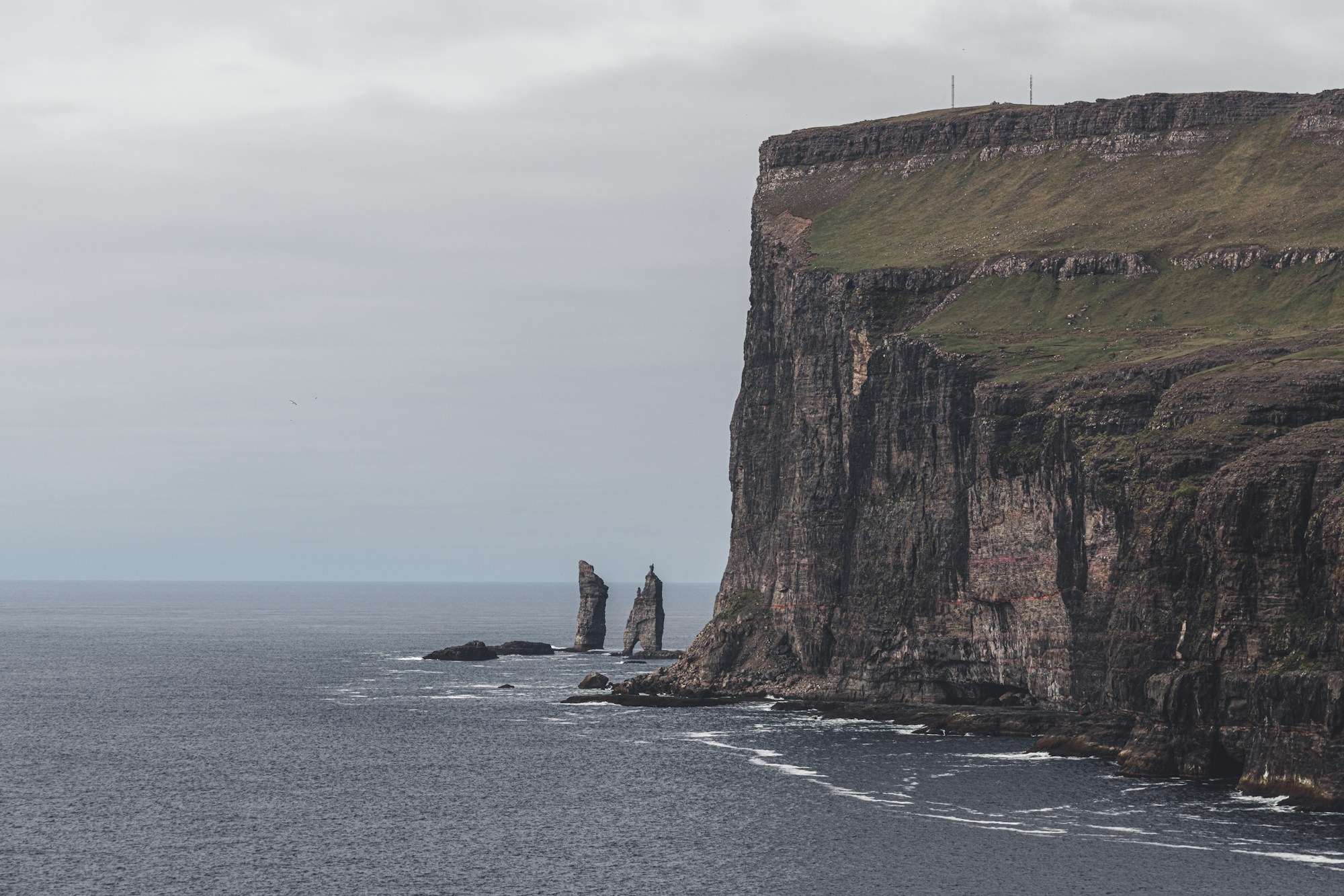 Spectacular sea stacks in the Faroe Islands, the Giant and the Witch, basalt cliffs in the North Atlantic