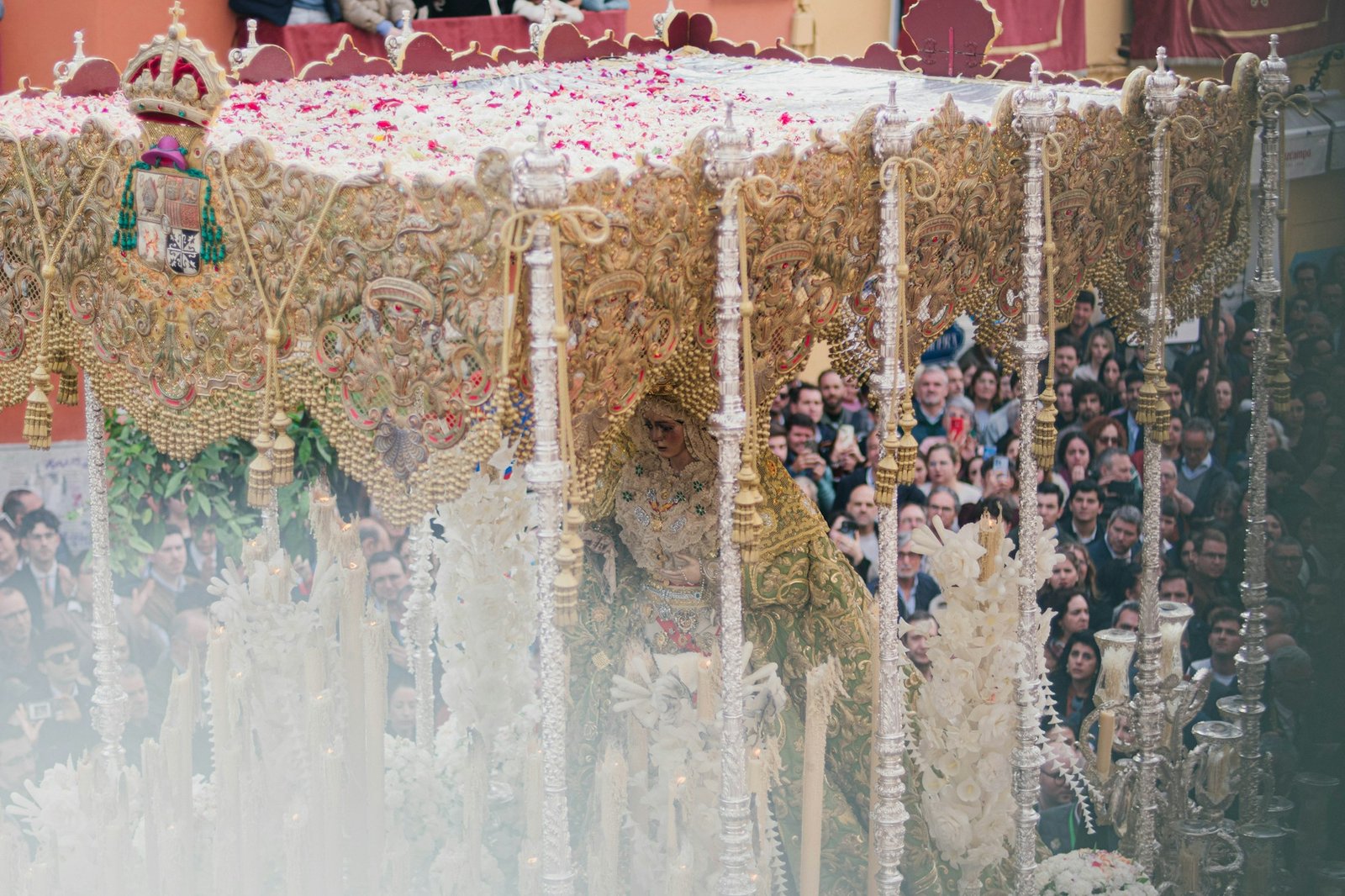 Semana Santa procession in Seville with nazarenos wearing capirotes