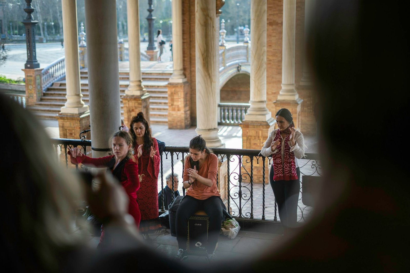 Flamenco dancer with musicians in a square in Seville