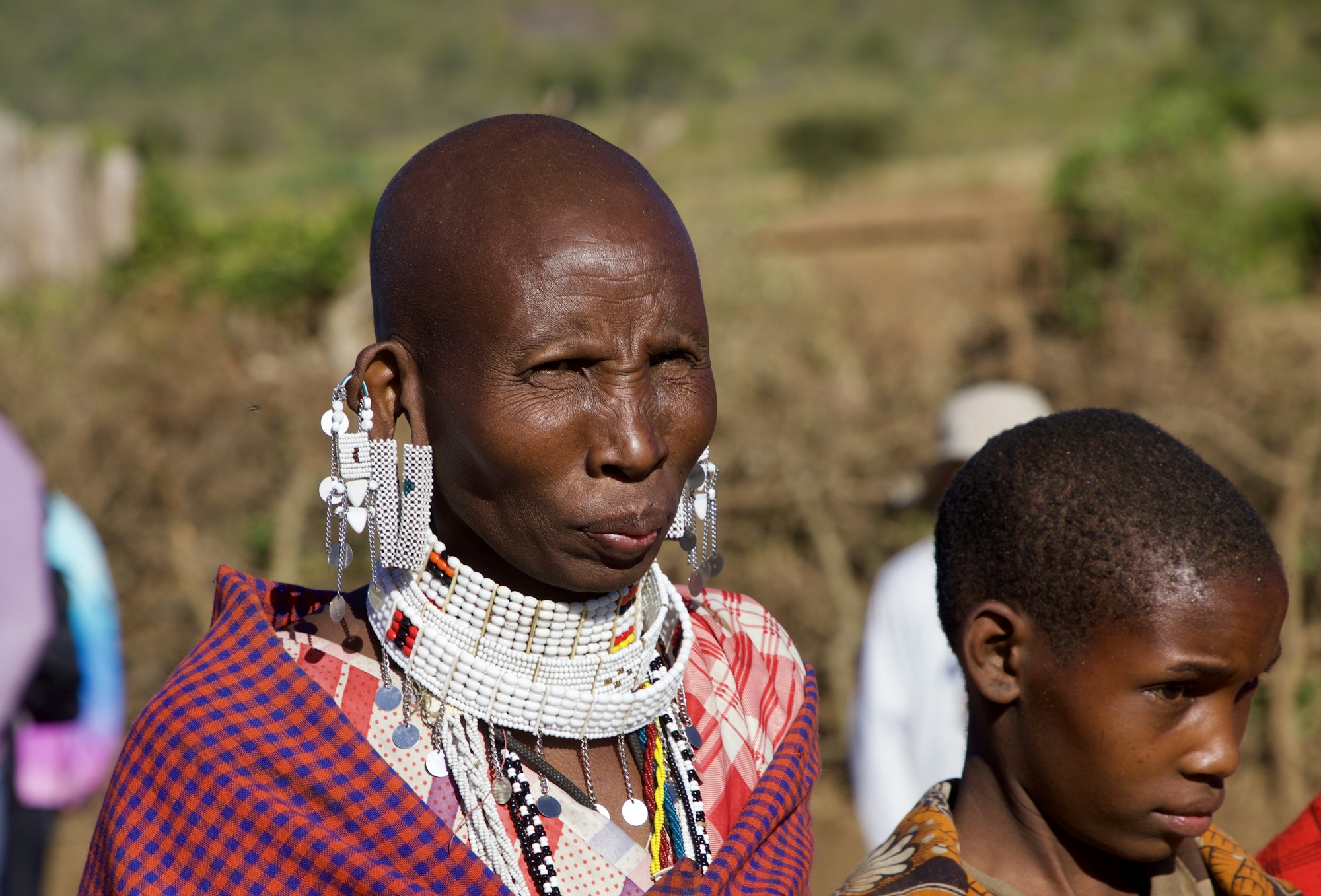 Maasai warrior in the Tanzanian savanna, representing the local communities with which volunteers work in Tanzania