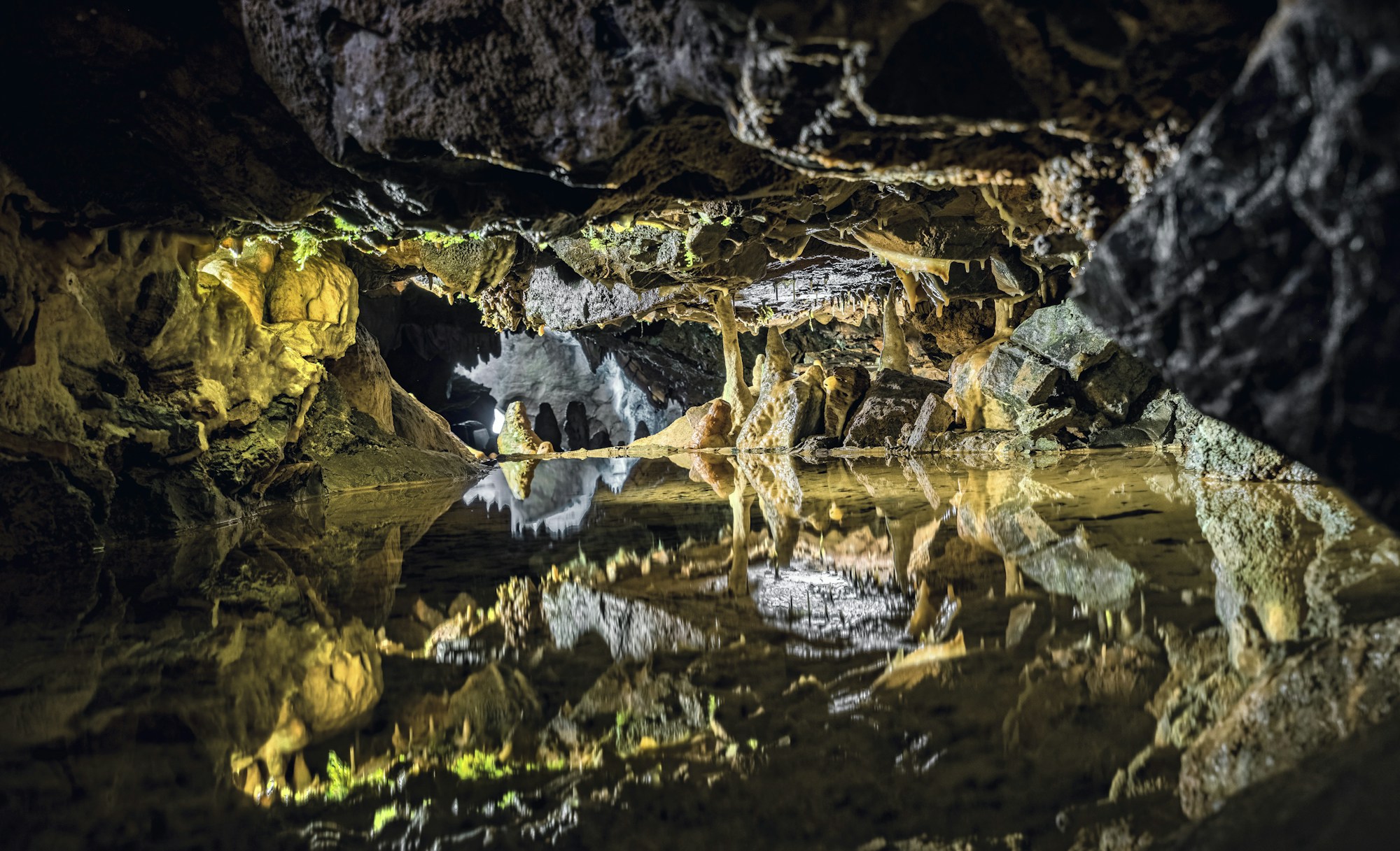 Underground exploration in a cave — adventure caving near Bled, Slovenia