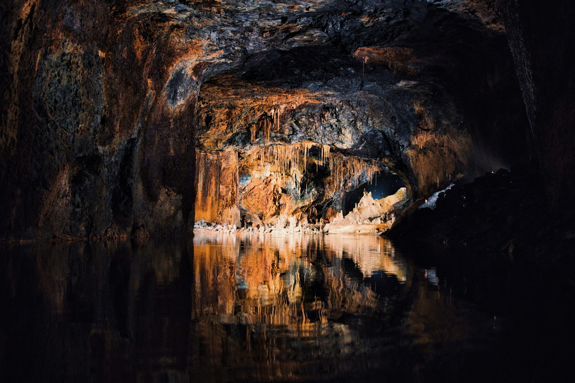 Impressive calcite formations — stalactites and stalagmites in an illuminated cave