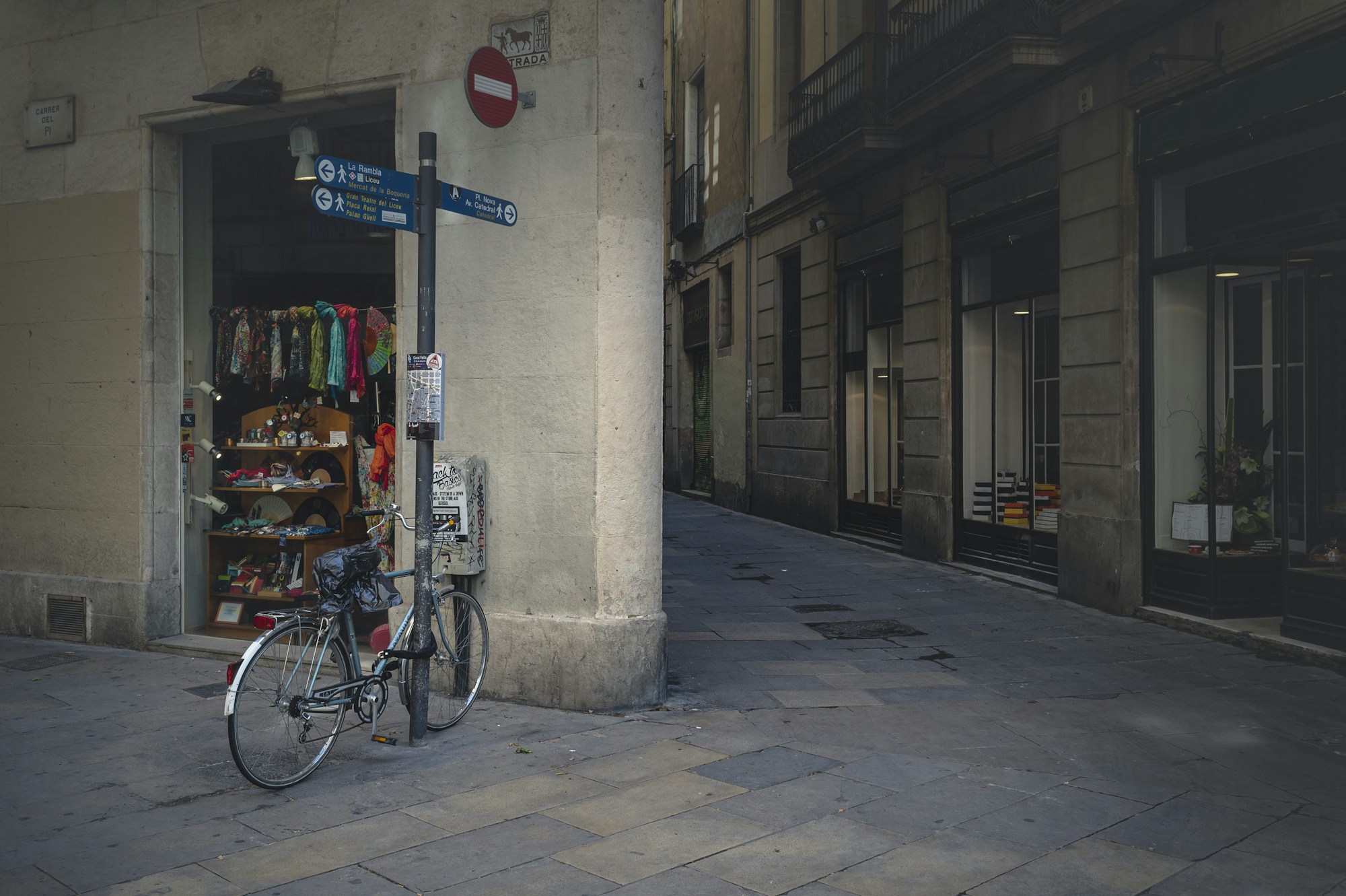 Alley in the Gothic Quarter of Barcelona with cobblestones and medieval architecture