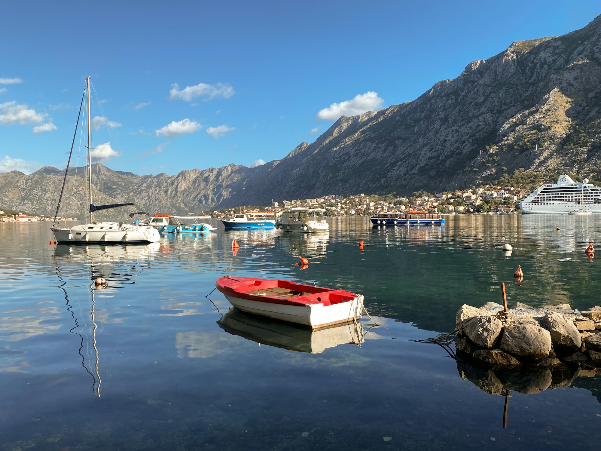 Boats in the Bay of Kotor surrounded by mountains, Montenegro