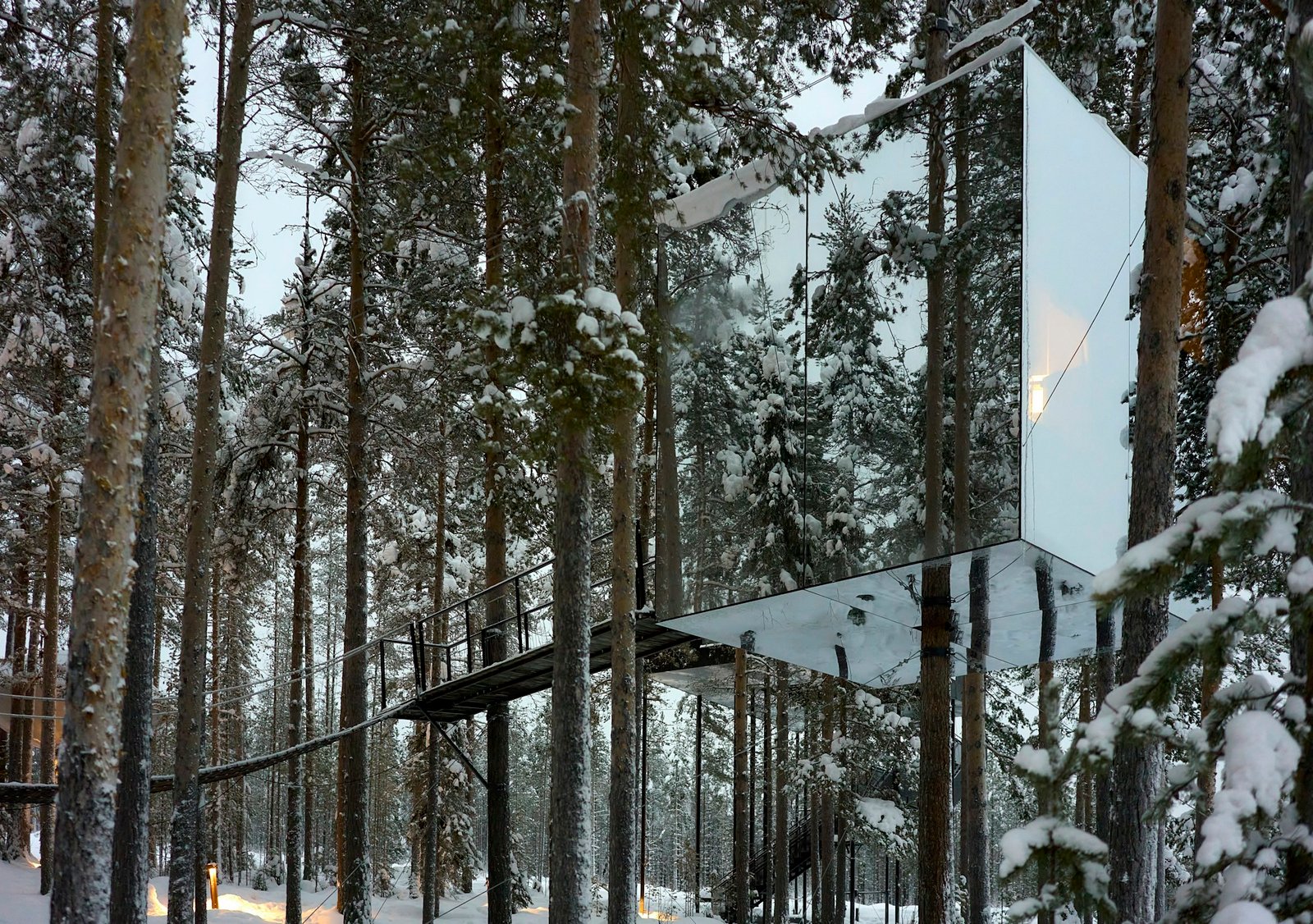 Mirror reflecting the snowy Swedish forest, design cabin at Treehotel in Harads, Lapland