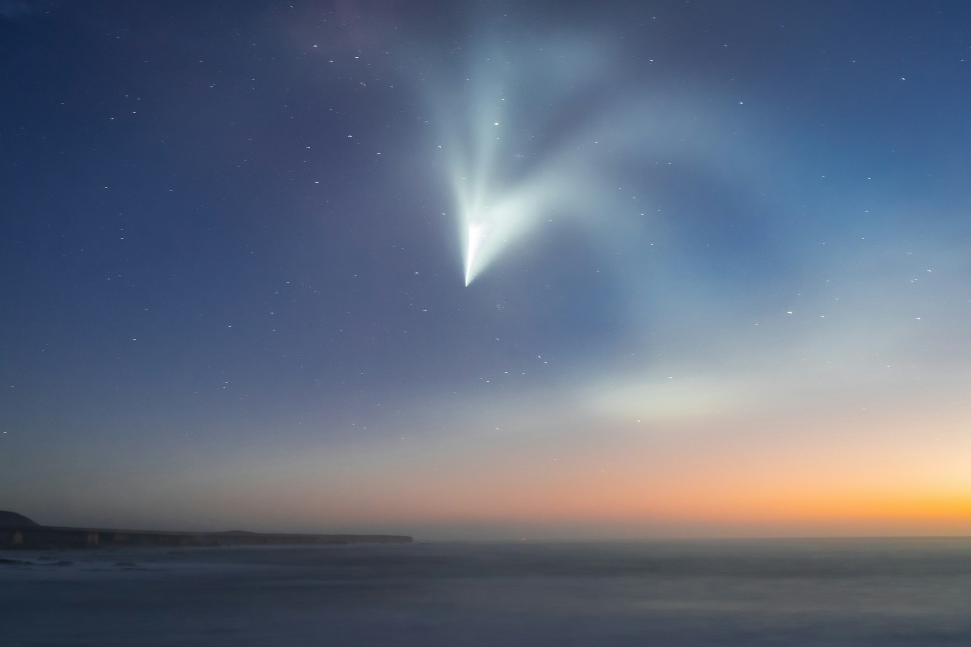 SpaceX Falcon 9 rocket launch at sunset — the same technology enabling private space missions like Polaris Dawn